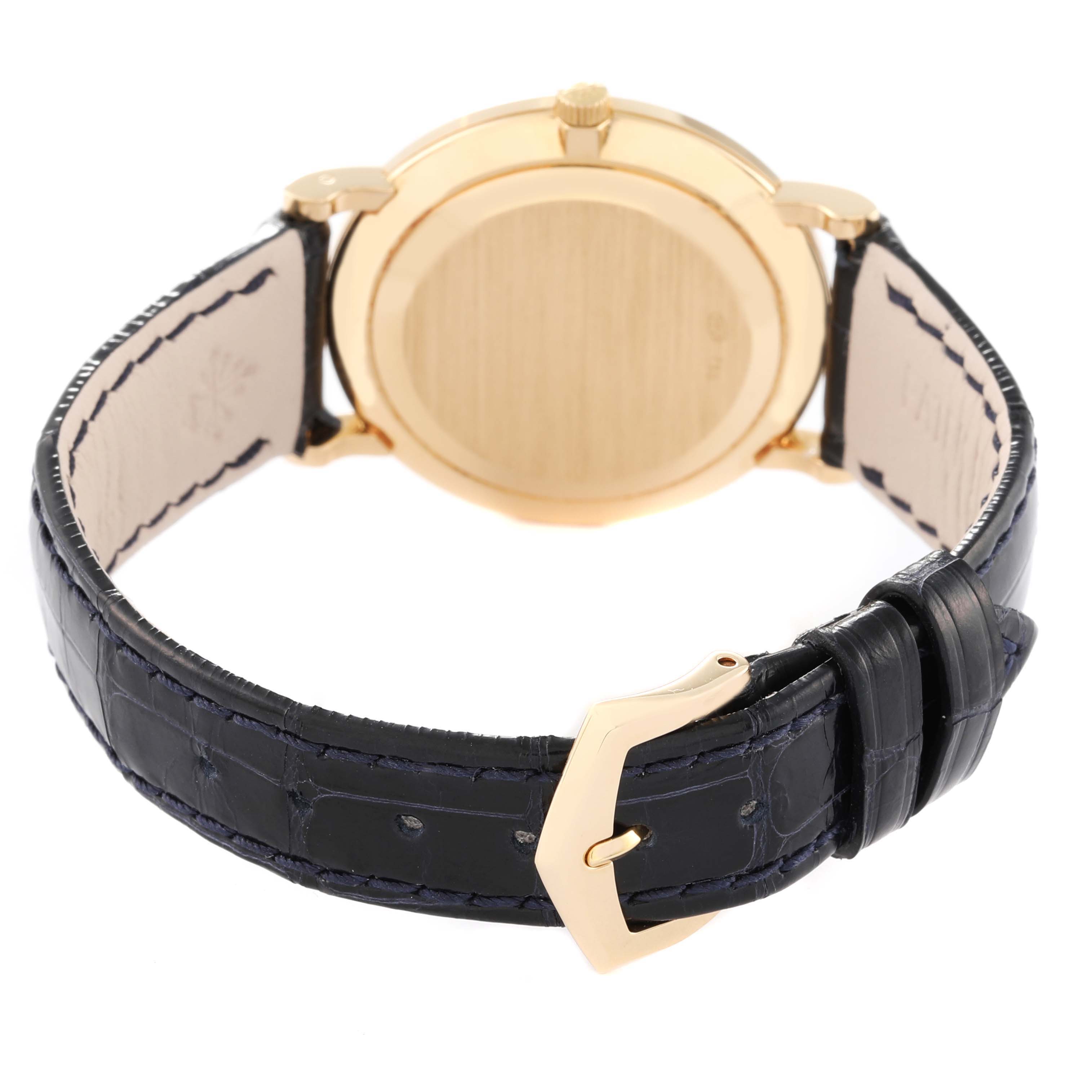 The image shows the back view of a Patek Philippe Calatrava 5022J Men
s Yellow Gold White Dial 5022J Men
s Yellow Gold White Dial watch, focusing on the case back, leather strap, and buckle.