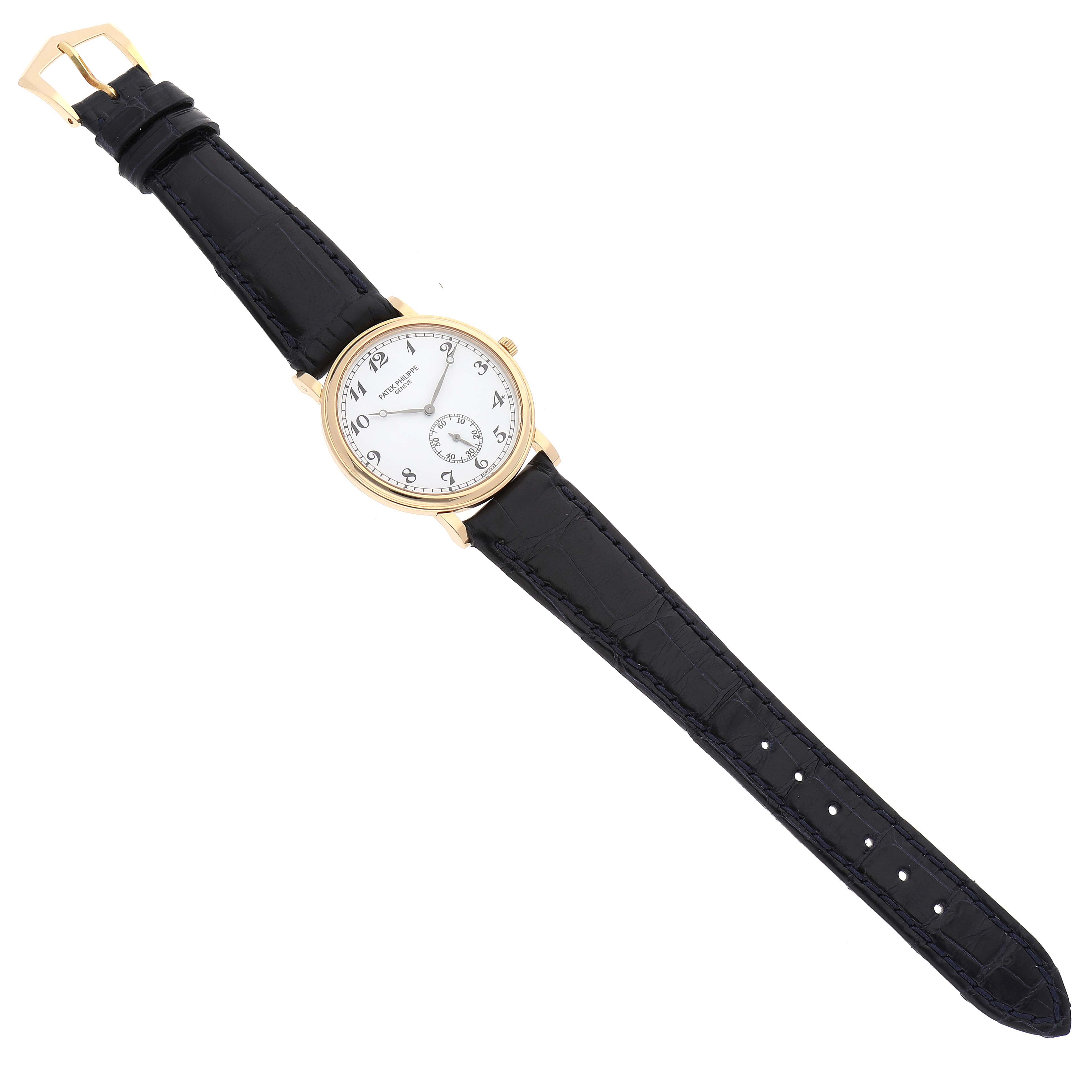 The image shows a Patek Philippe Calatrava 5022J Men
s Yellow Gold White Dial 5022J Men
s Yellow Gold White Dial watch at a slight angle, highlighting the face, strap, and buckle.