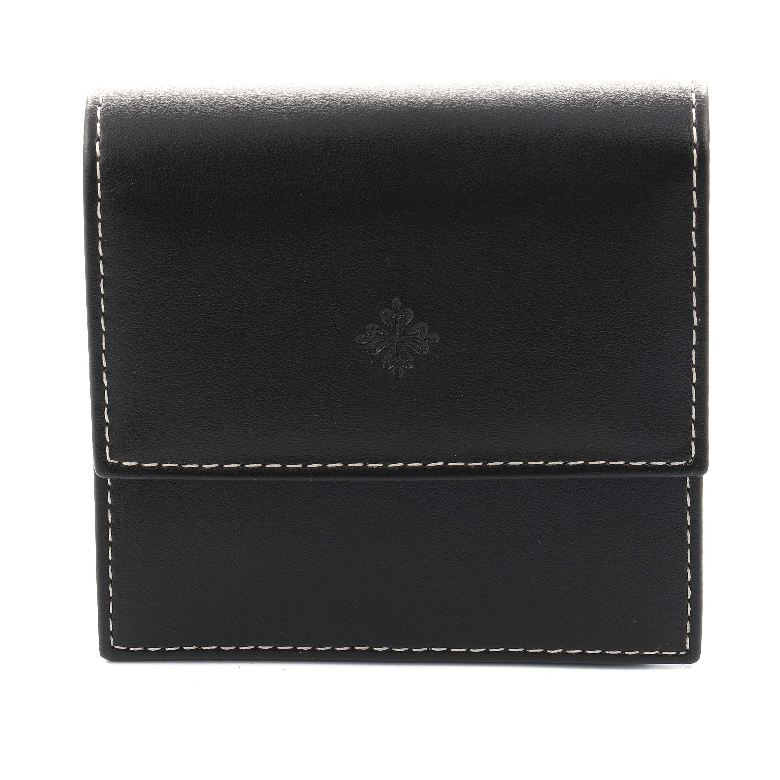 The image shows a closed, black leather case with contrast stitching, embossed with the Patek Philippe logo for the Twenty-4 model.