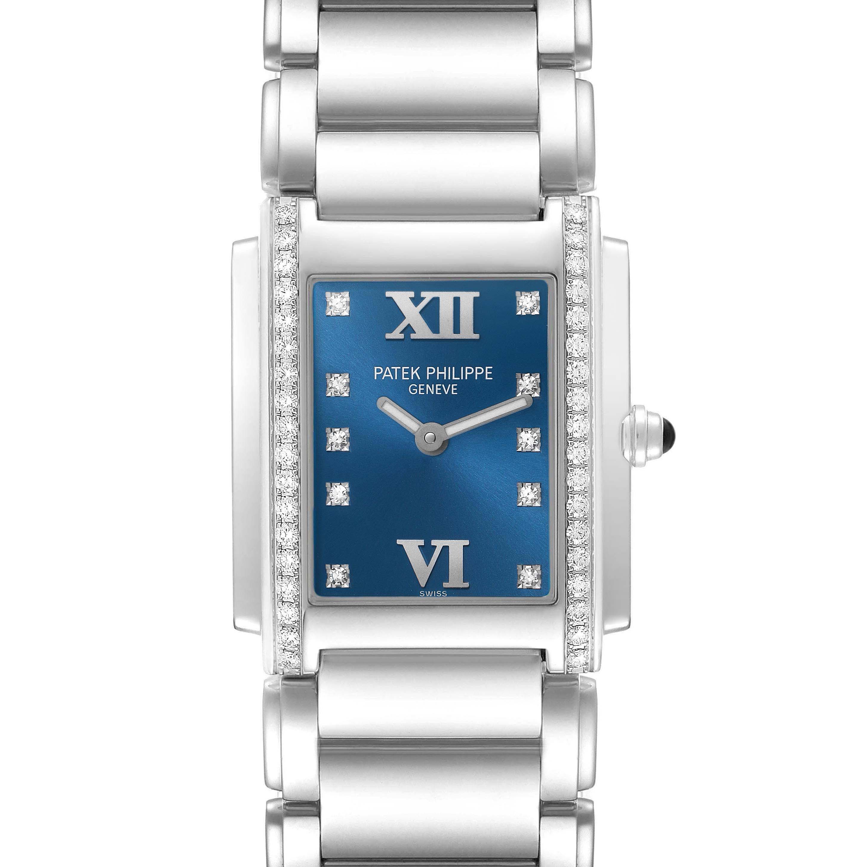 The Patek Philippe Twenty-4 4910 Women
s Stainless Steel Blue Dial watch is shown from the front, highlighting its rectangular face, blue dial, diamond accents, and bracelet.