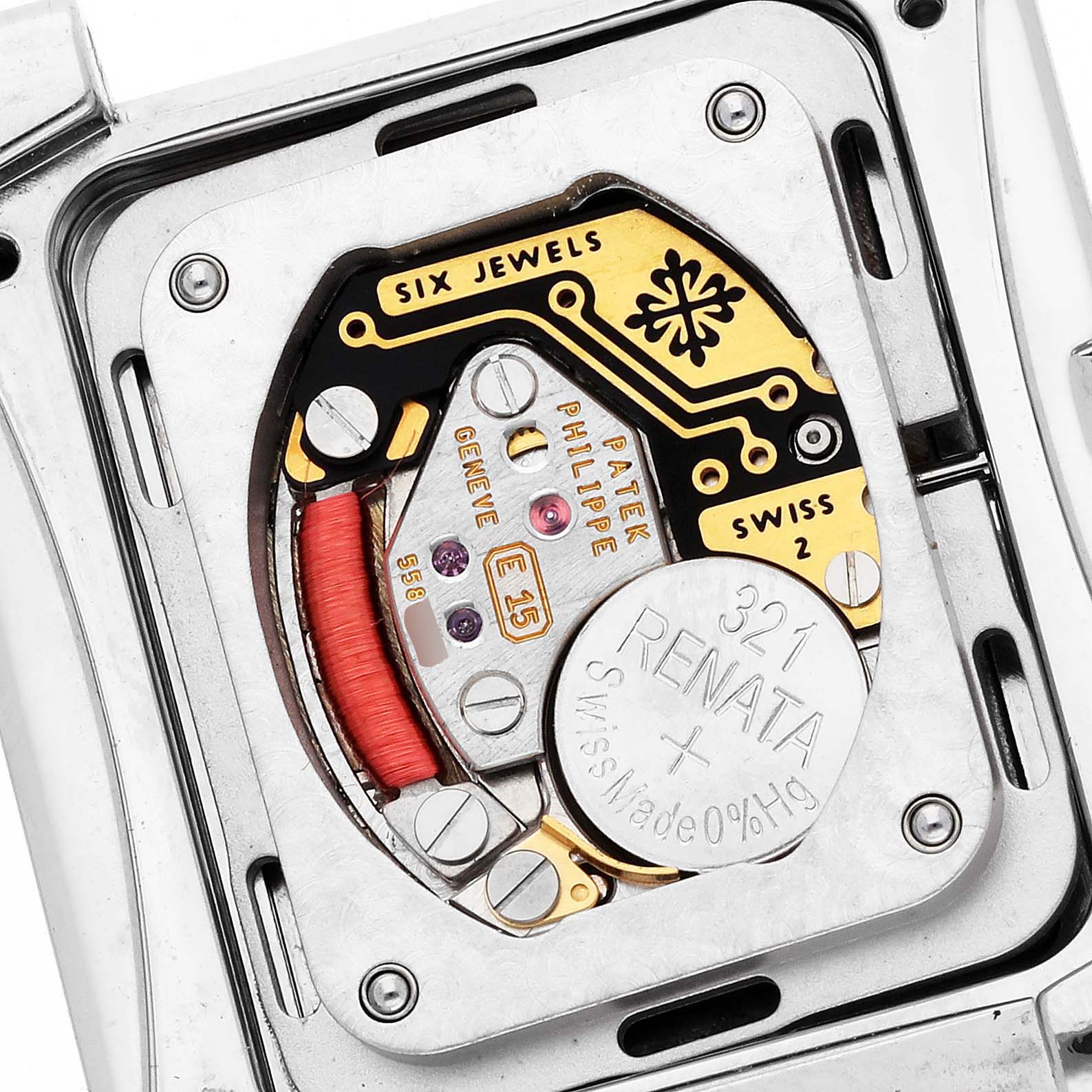 The image shows the movement of a Patek Philippe Twenty-4 4910 Women
s Stainless Steel Blue Dial watch, highlighting its intricate internal components from a close-up angle.