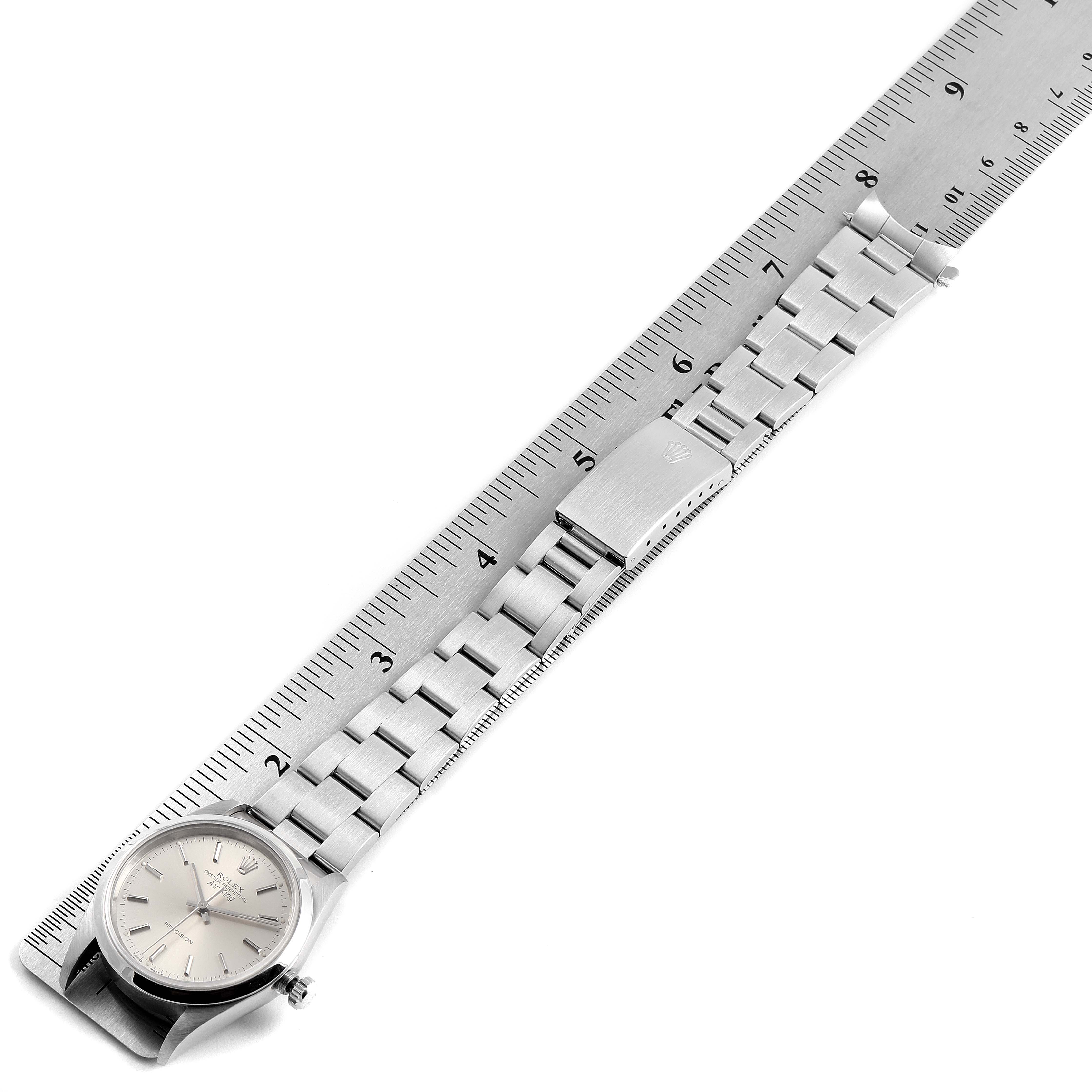 The image shows a Rolex Air-King 14000 Men's Stainless Steel Silver Dial 14000 Men's Stainless Steel Silver Dial watch laid flat, with the dial and bracelet aligned next to a ruler.