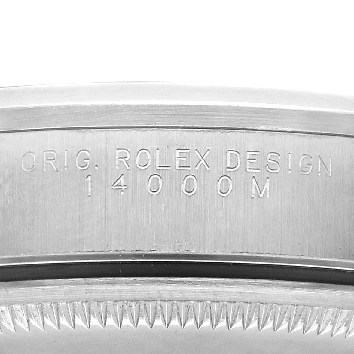 The image shows a close-up of the side of a Rolex Air-King 14000 Men
s Stainless Steel Silver Dial watch case with engraved text.