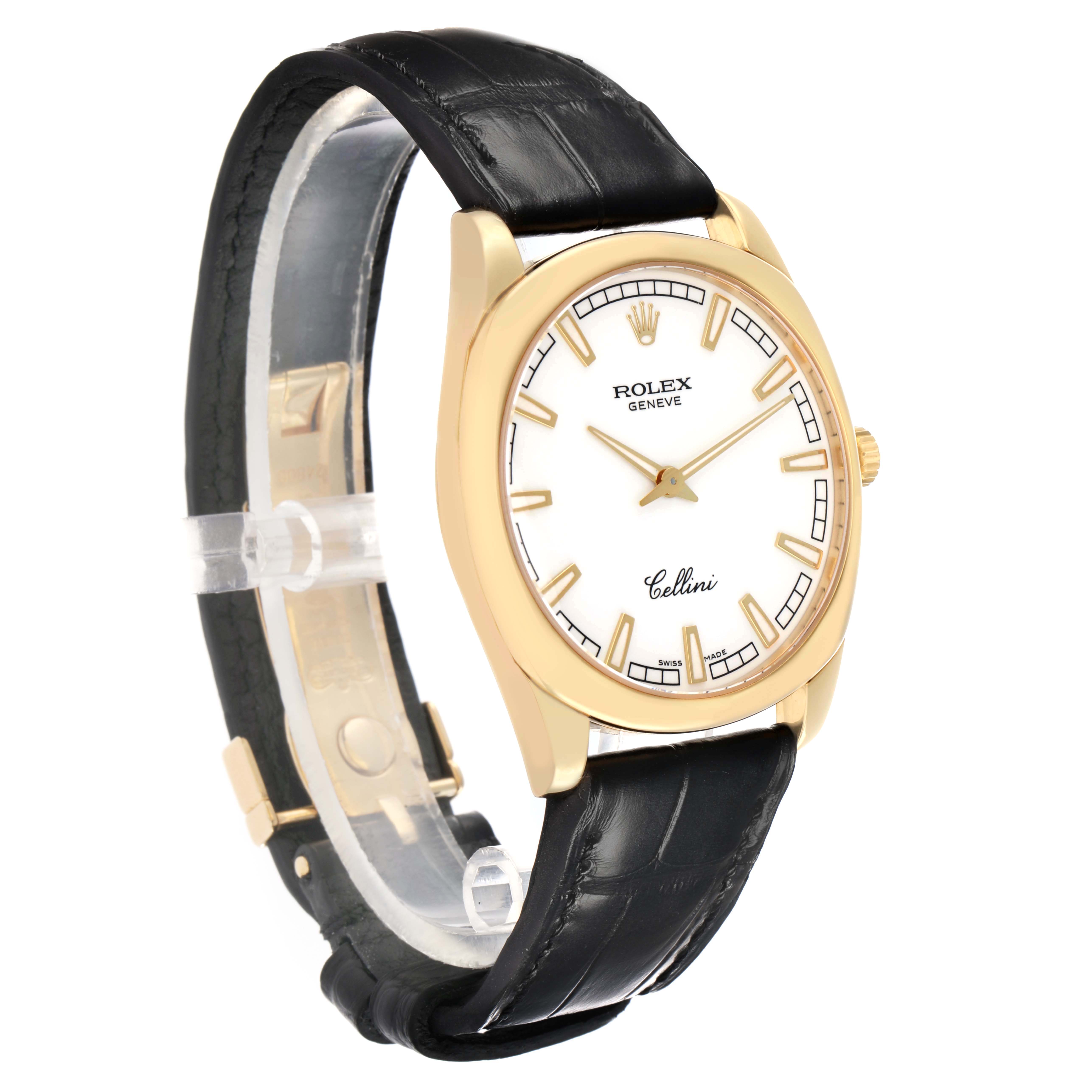 The Rolex Cellini 4243 Men
s Yellow Gold White Dial watch is shown at an angled side view, highlighting the face, gold case, crown, and black leather strap.