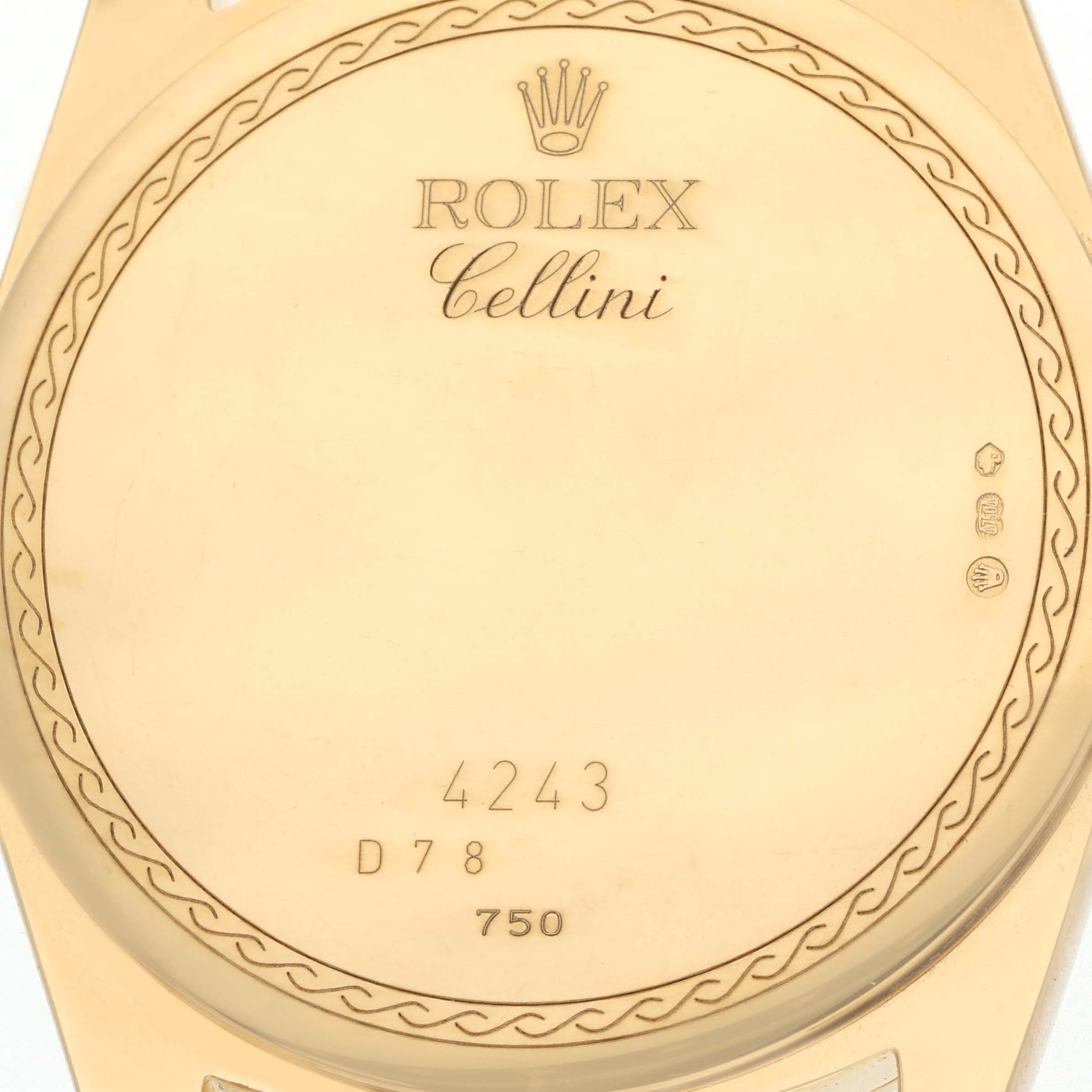 The image shows the back casing of a Rolex Cellini 4243 Men
s Yellow Gold White Dial watch, featuring the brand logo and model engraving.