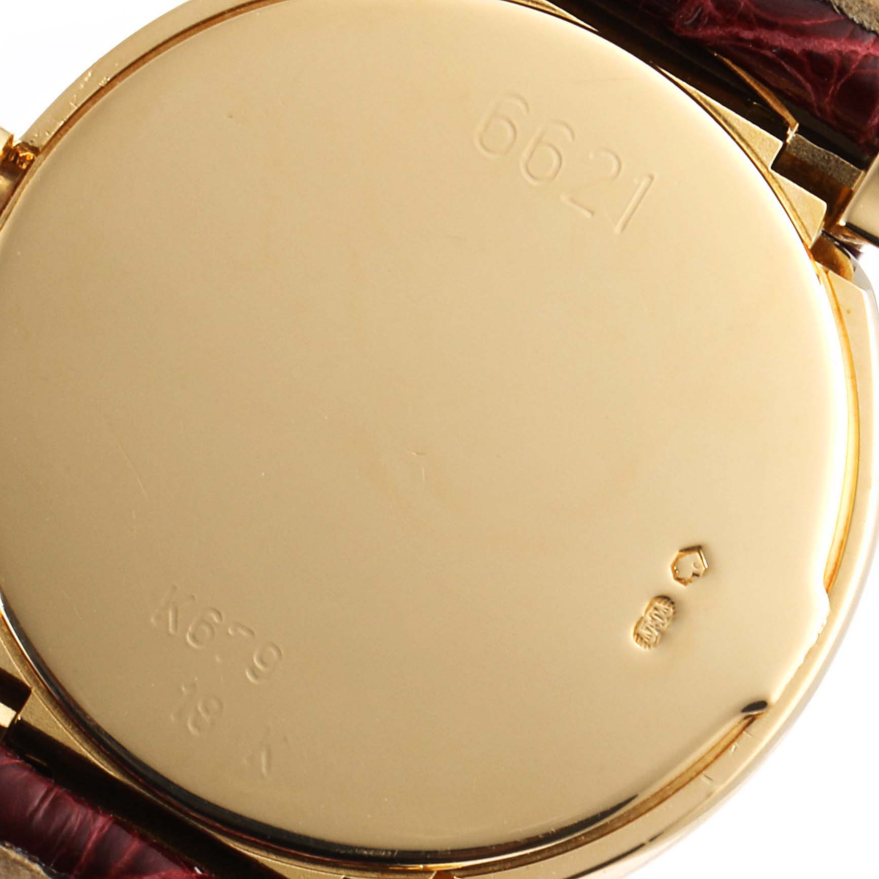 This image shows the back case of a Rolex Cellini 6621 Women's Yellow Gold White Dial 6621 Women's Yellow Gold White Dial watch model 6621 with visible engravings and hallmarks.