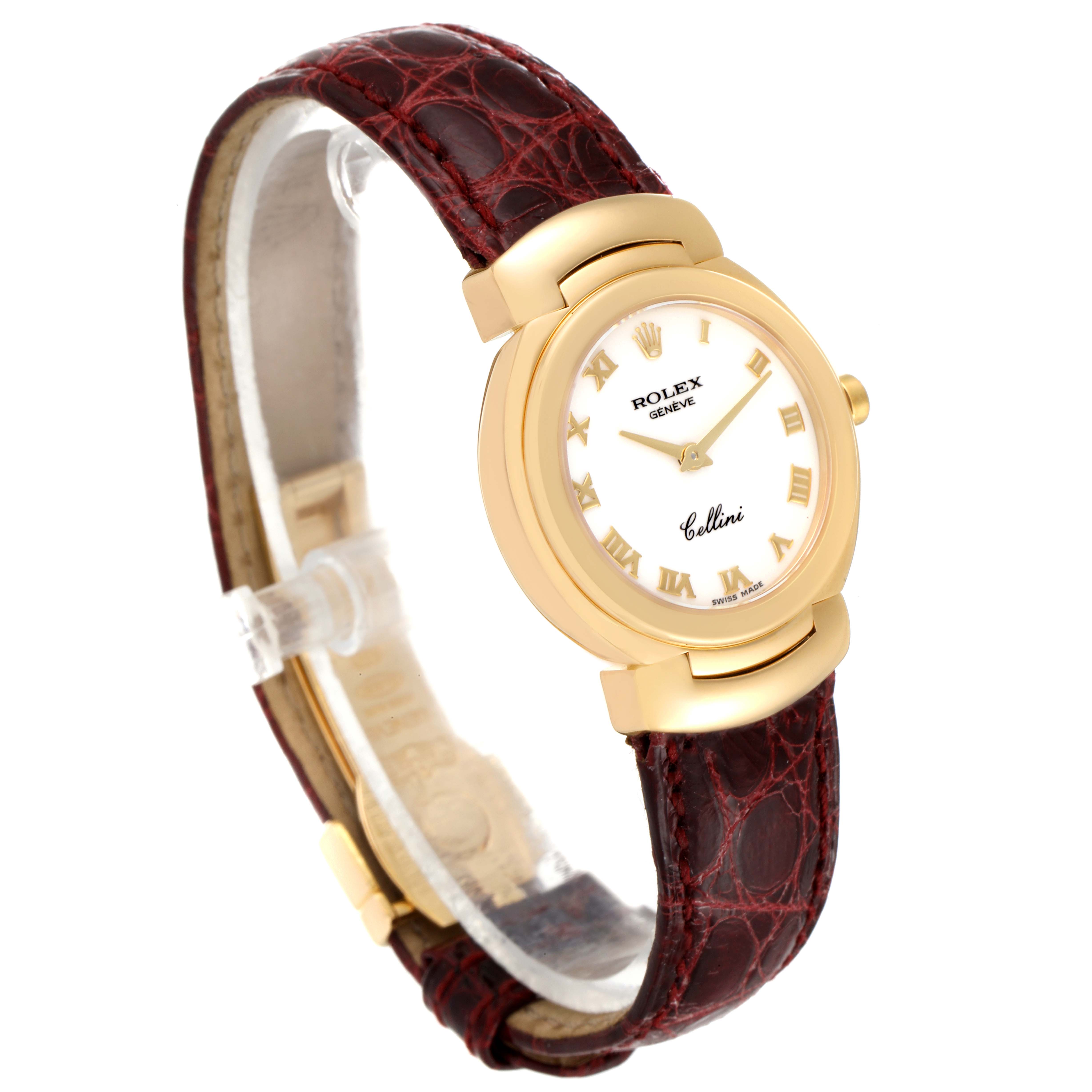 The Rolex Cellini 6621 Women's Yellow Gold White Dial 6621 Women's Yellow Gold White Dial watch is shown at an angled view, featuring its gold case, white dial with Roman numerals, and brown leather strap.