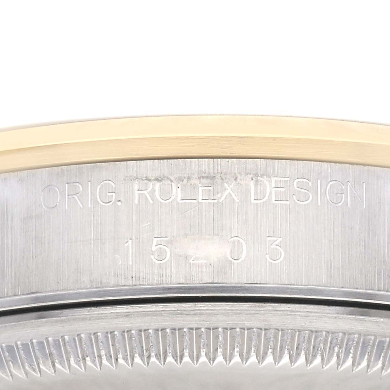 This close-up image shows the engraved model number "15203" on the side of the Rolex Date 15203 Men's Steel and Gold (two tone) White Dial 15203 Men's Steel and Gold (two tone) White Dial watch case.