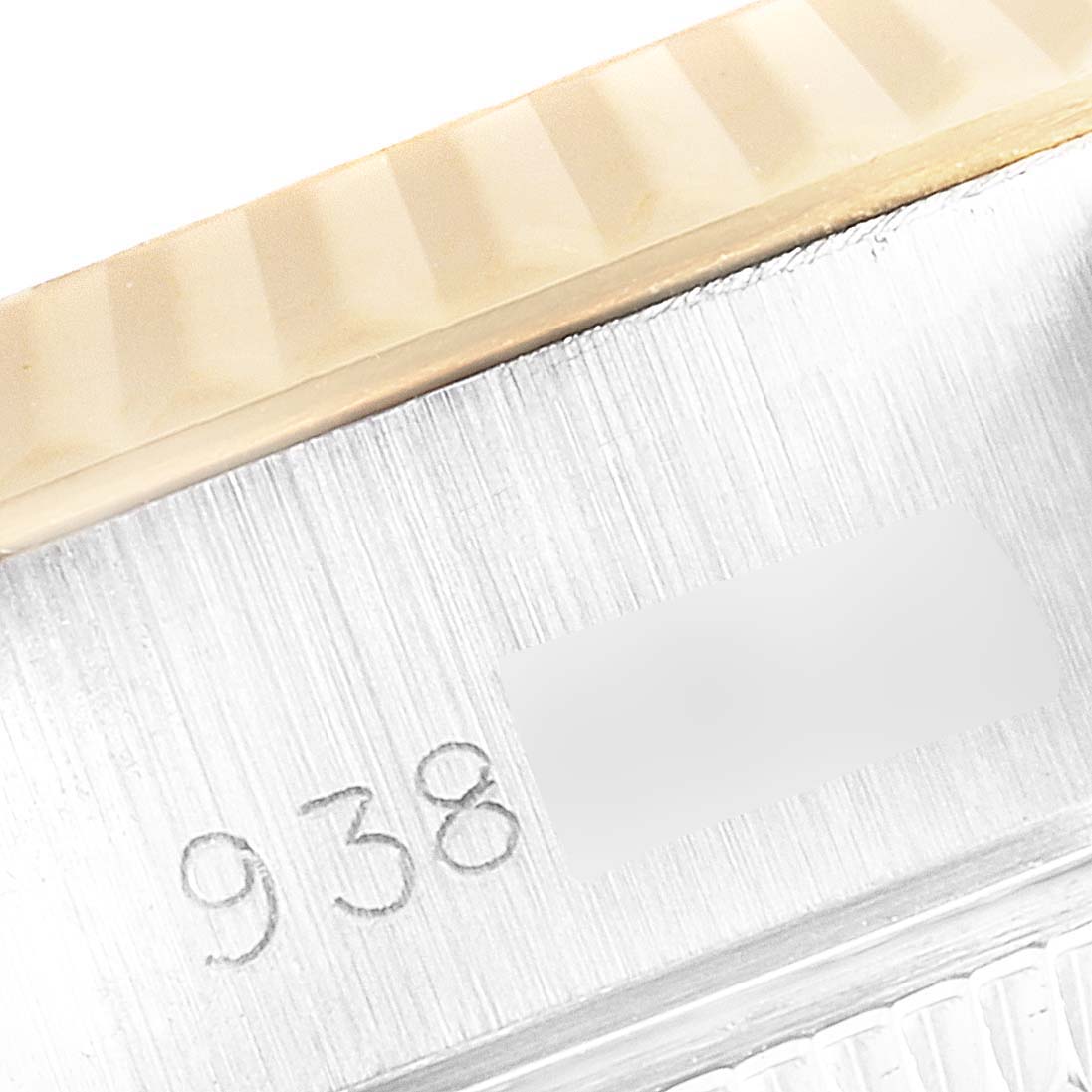 This image shows a close-up of the bezel and case-side engraving of a Rolex Datejust 69173 Women's Steel and Gold (two tone) Champagne Dial 69173 Women's Steel and Gold (two tone) Champagne Dial watch.