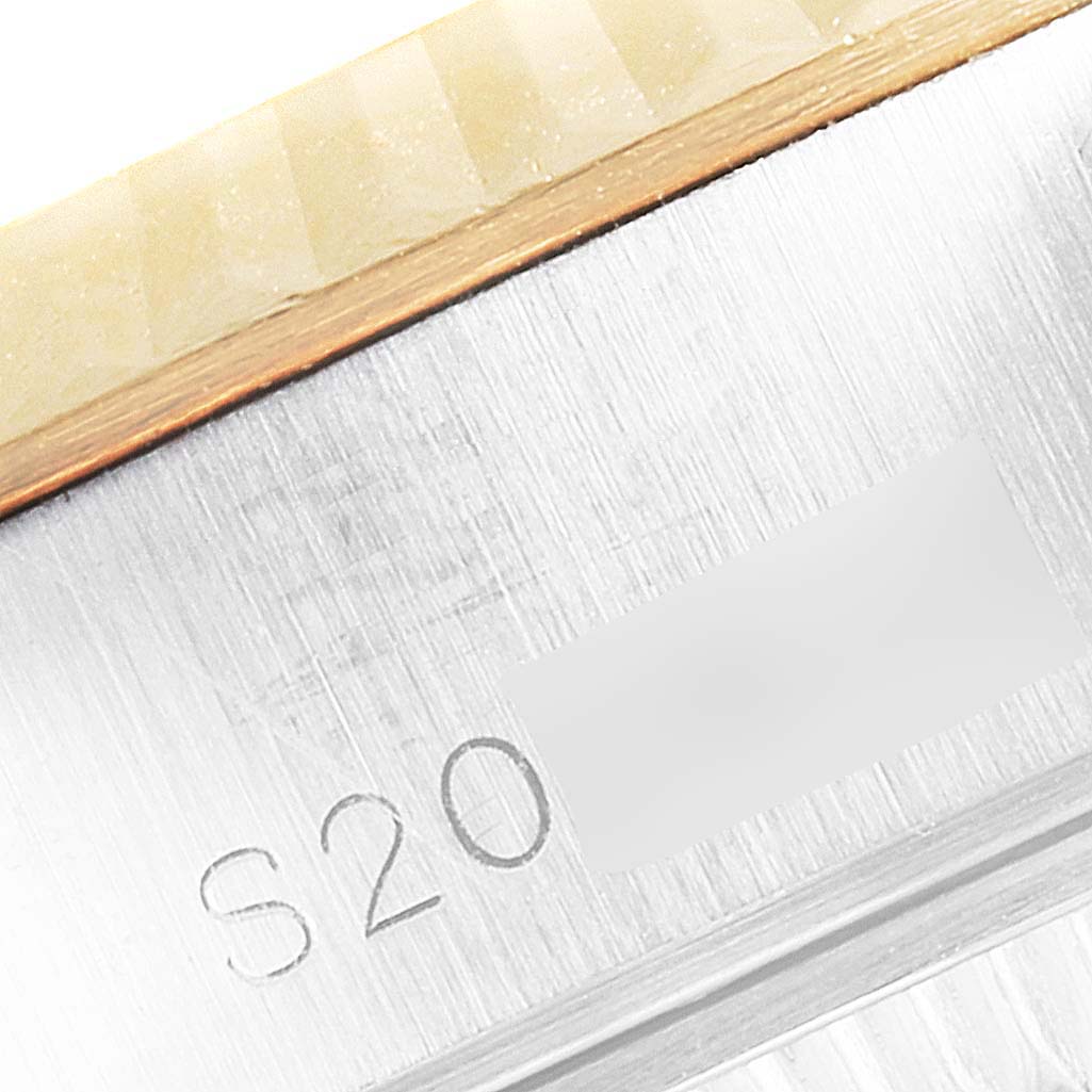 This image shows a close-up of the serial number engraving on the case of a Rolex Datejust 69173 Women's Steel and Gold (two tone) Champagne Dial 69173 Women's Steel and Gold (two tone) Champagne Dial watch.