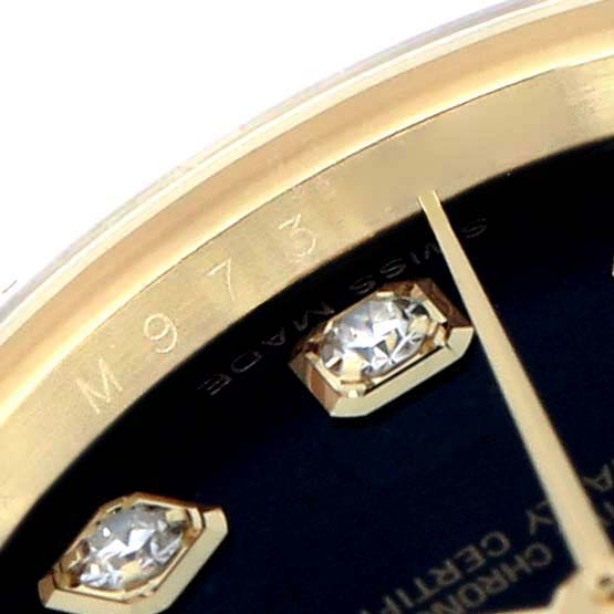 The image shows a close-up of a Rolex Datejust 179138 Women
s Yellow Gold Black Dial watch, highlighting the bezel, dial with diamond markers, and a portion of the hands.