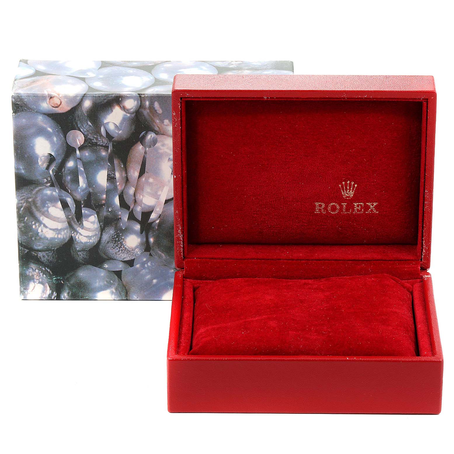 The image shows a red Rolex watch box with the lid open, revealing a red velvet interior and pillow, with an outer box featuring a pearlescent design in the background.