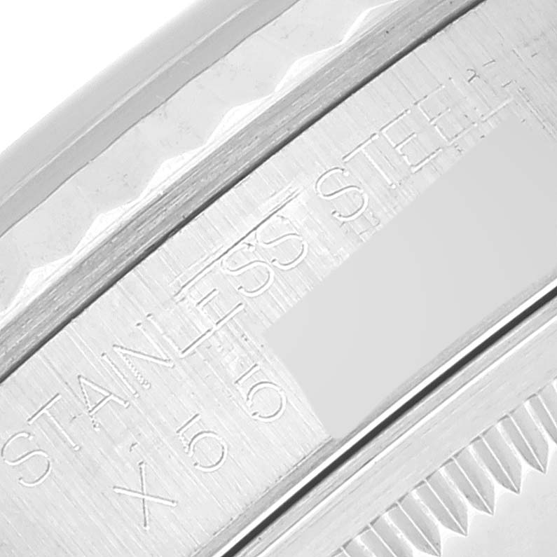 This image shows a close-up of the engraved stainless steel case of a Rolex Datejust 16234 Men's Stainless Steel Silver Dial 16234 Men's Stainless Steel Silver Dial watch.