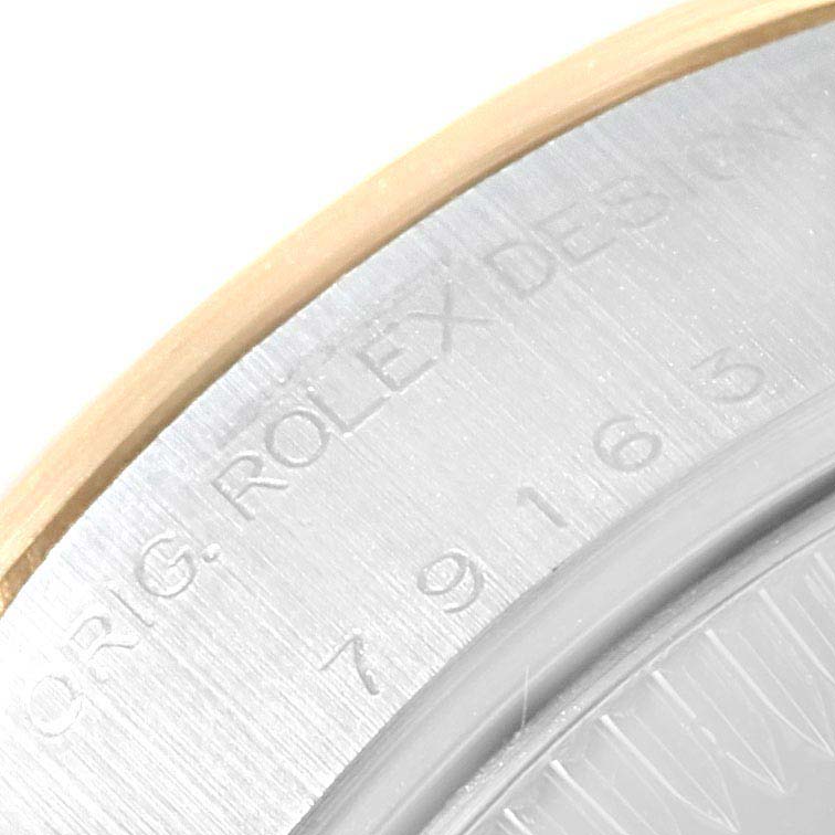 This close-up image shows the edge of the case back engraving of a Rolex Datejust 79163 Women's Steel and Gold (two tone) Champagne Dial 79163 Women's Steel and Gold (two tone) Champagne Dial watch.
