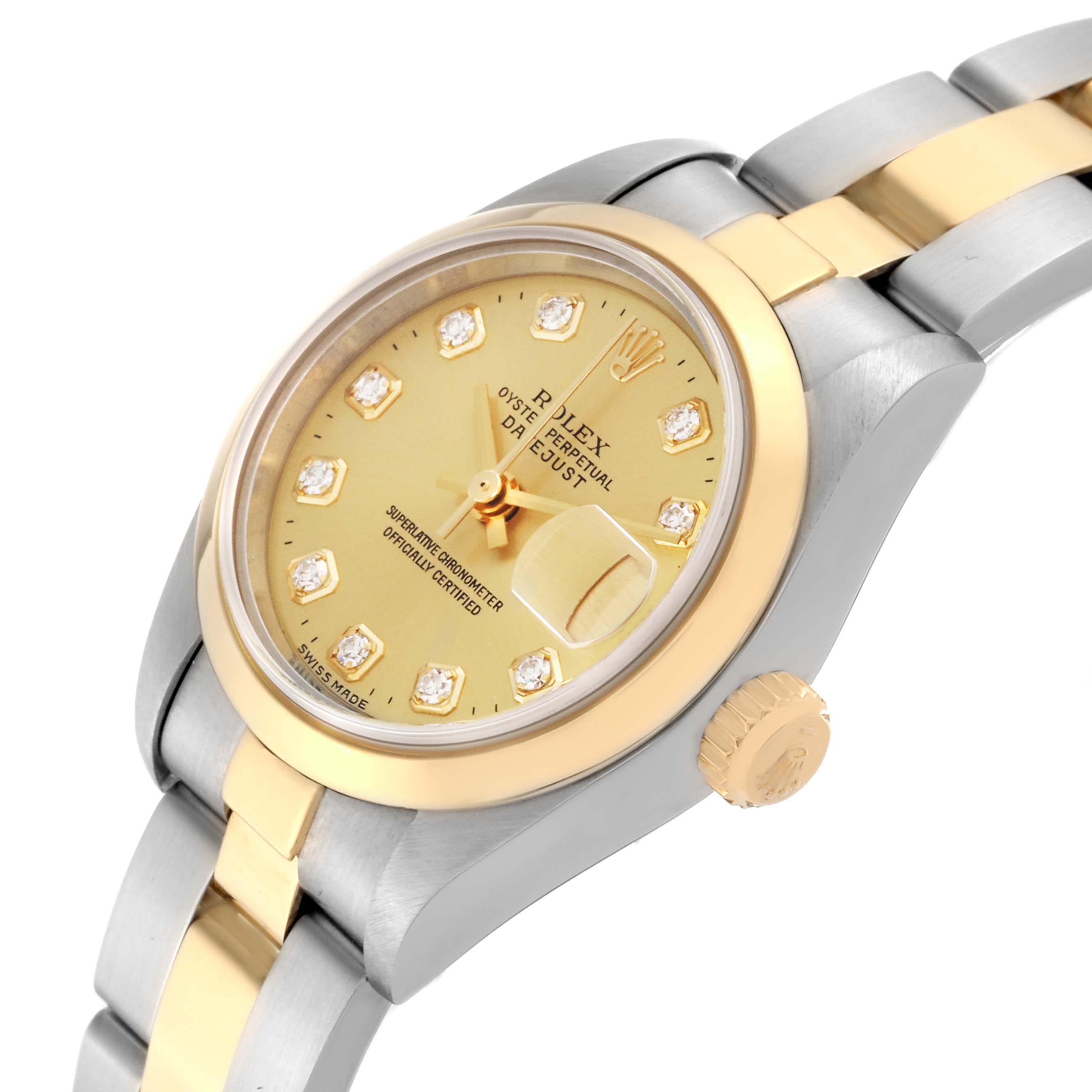 The image shows a close-up angle of the Rolex Datejust 79163 Women
s Steel and Gold (two tone) Champagne Dial 79163 Women
s Steel and Gold (two tone) Champagne Dial watch, highlighting its dial, crown, and part of the bracelet.