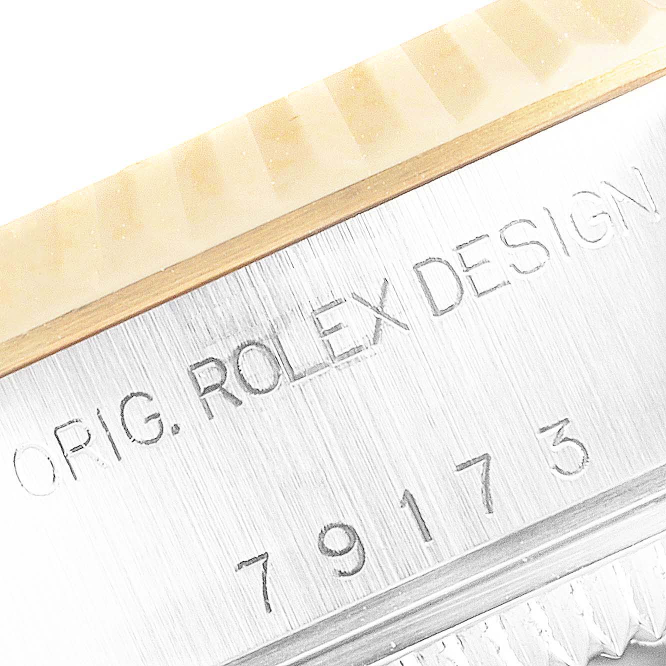 The image shows a close-up of the bezel and case side of a Rolex Datejust 79173 Women's Steel and Gold (two tone) Champagne Dial 79173 Women's Steel and Gold (two tone) Champagne Dial watch with the engraved model number 79173.