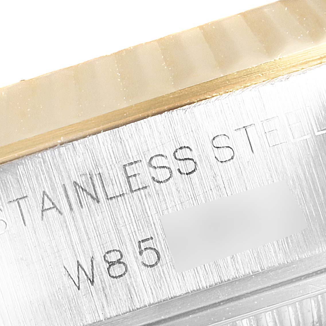 The image shows a close-up of the side casing with engravings of the Rolex Datejust 69173 Women's Steel and Gold (two tone) Champagne Dial 69173 Women's Steel and Gold (two tone) Champagne Dial model.