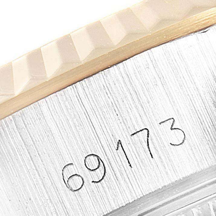 This close-up shows the side of the bezel and case, with the reference number of the Rolex Datejust 69173 Women's Stainless Steel Beige Dial 69173 Women's Stainless Steel Beige Dial visible.
