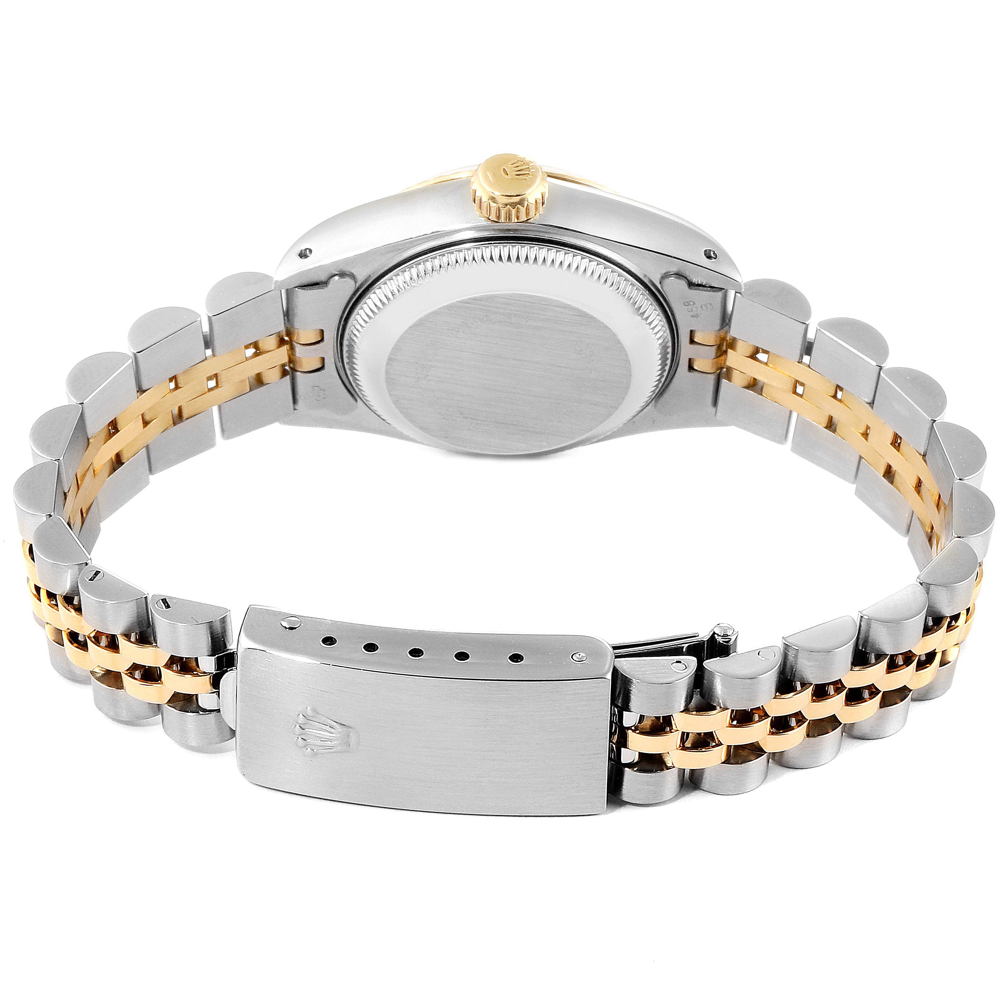 This image shows the backside of a Rolex Datejust 69173 Women's Stainless Steel Beige Dial 69173 Women's Stainless Steel Beige Dial watch, featuring its case back, crown, and two-tone bracelet with clasp.