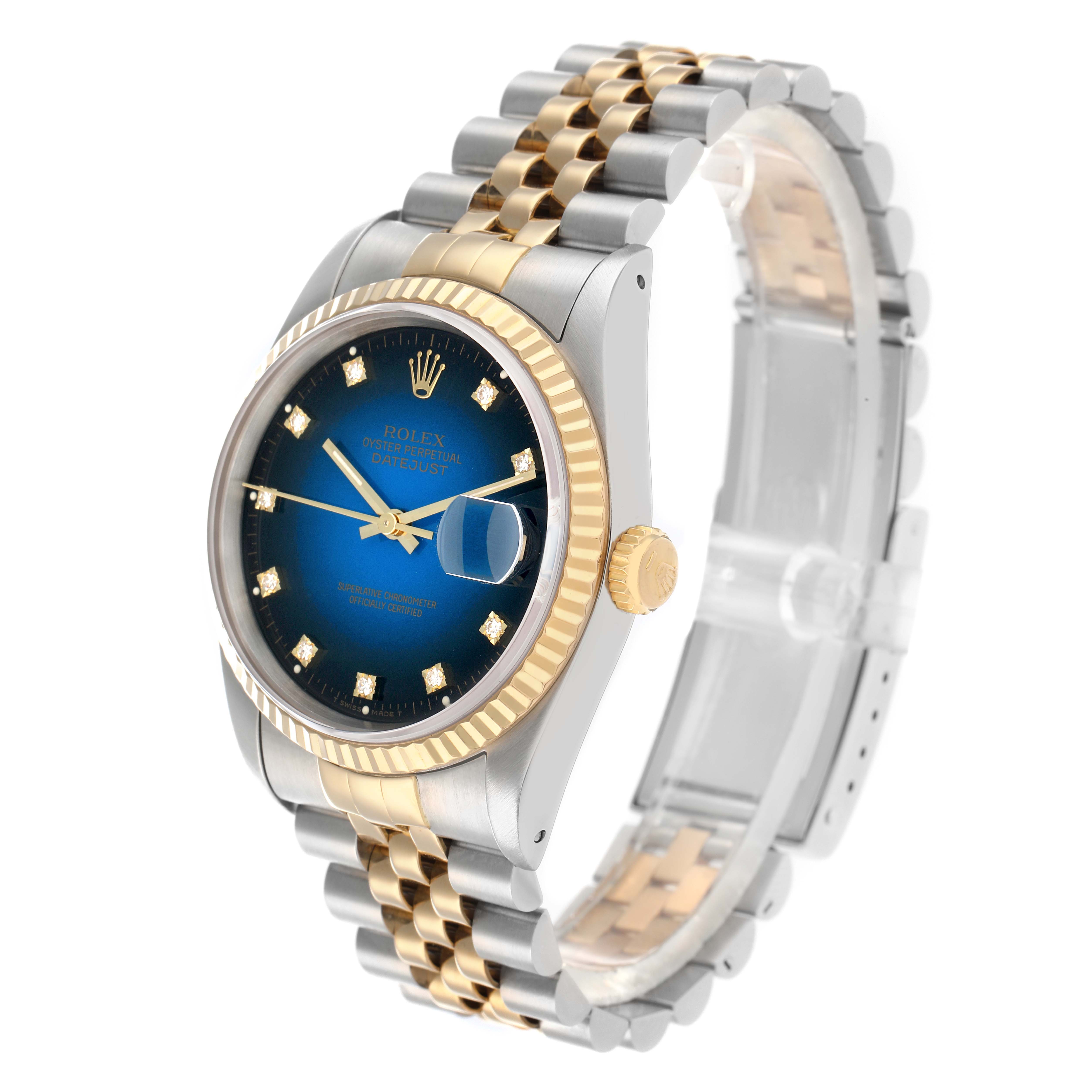 The Rolex Datejust 16233 Men
s Steel and Gold (two tone) Blue Dial is shown at a three-quarter angle, highlighting the dial, bezel, crown, and part of the bracelet.