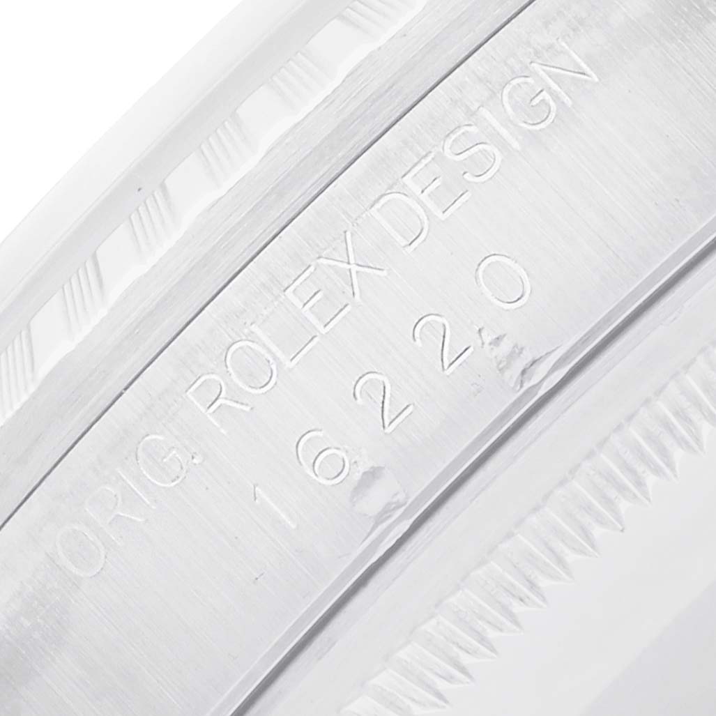 The image shows a close-up of the engraved inner bezel of a Rolex Datejust 16220 Men
s Stainless Steel White Dial, emphasizing the "Orig. Rolex Design" text and model number.