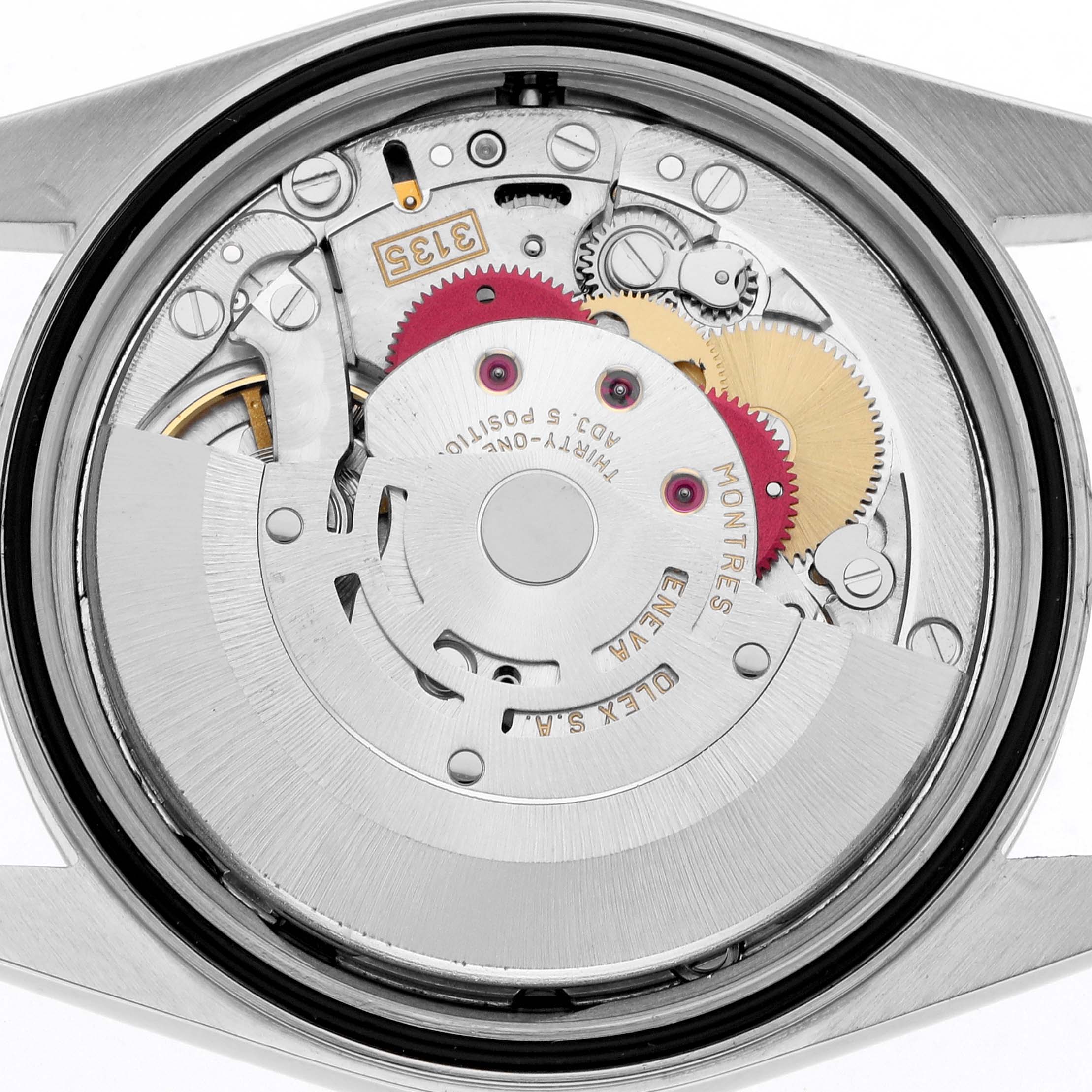 The image shows the internal movement of a Rolex Datejust 16220 Men
s Stainless Steel White Dial watch from a top view angle, highlighting gears and mechanical components.