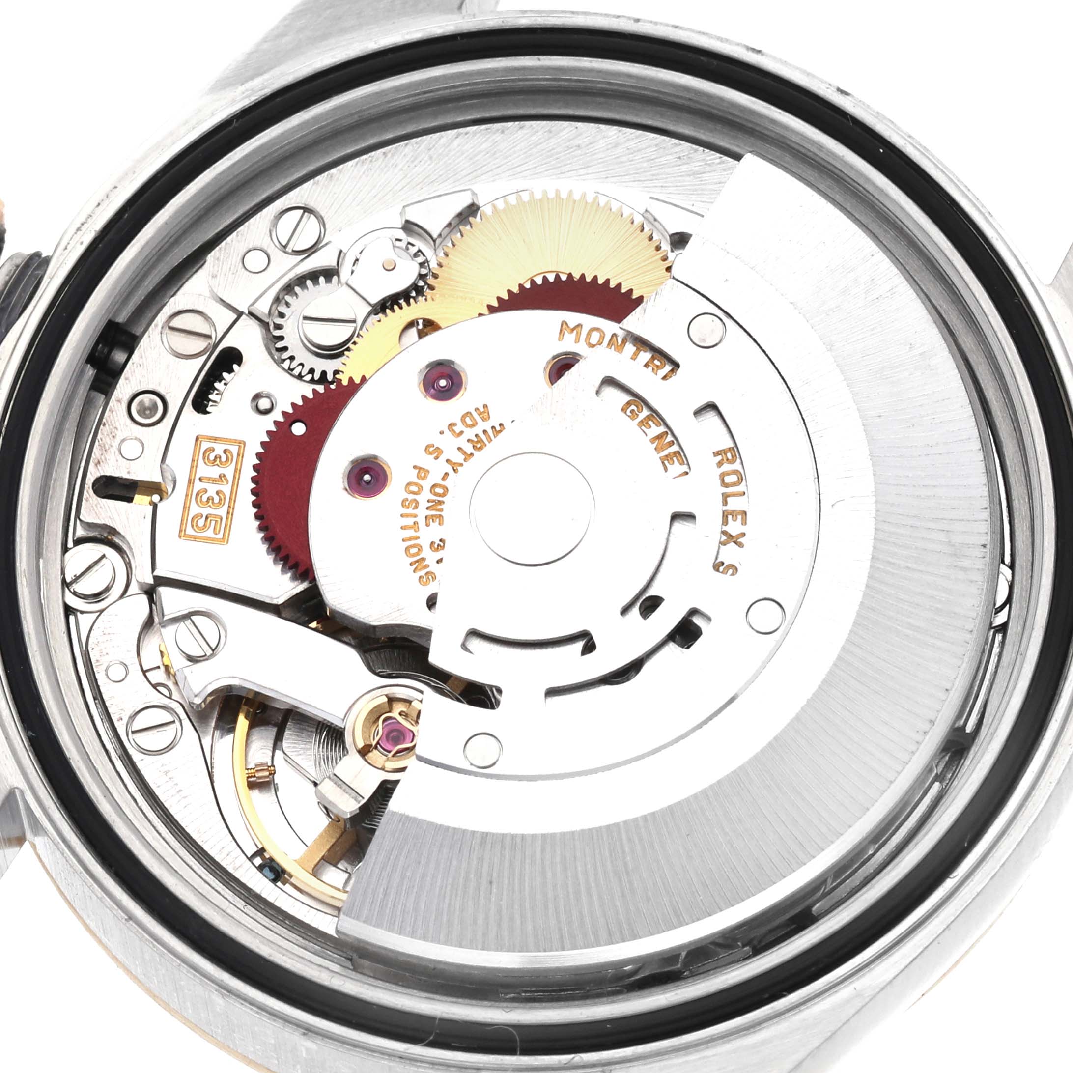 This image shows a detailed view of the movement mechanism inside a Rolex Datejust 16233 Men's Steel and Gold (two tone) White Dial 16233 Men's Steel and Gold (two tone) White Dial watch, highlighting the gears and rotor.