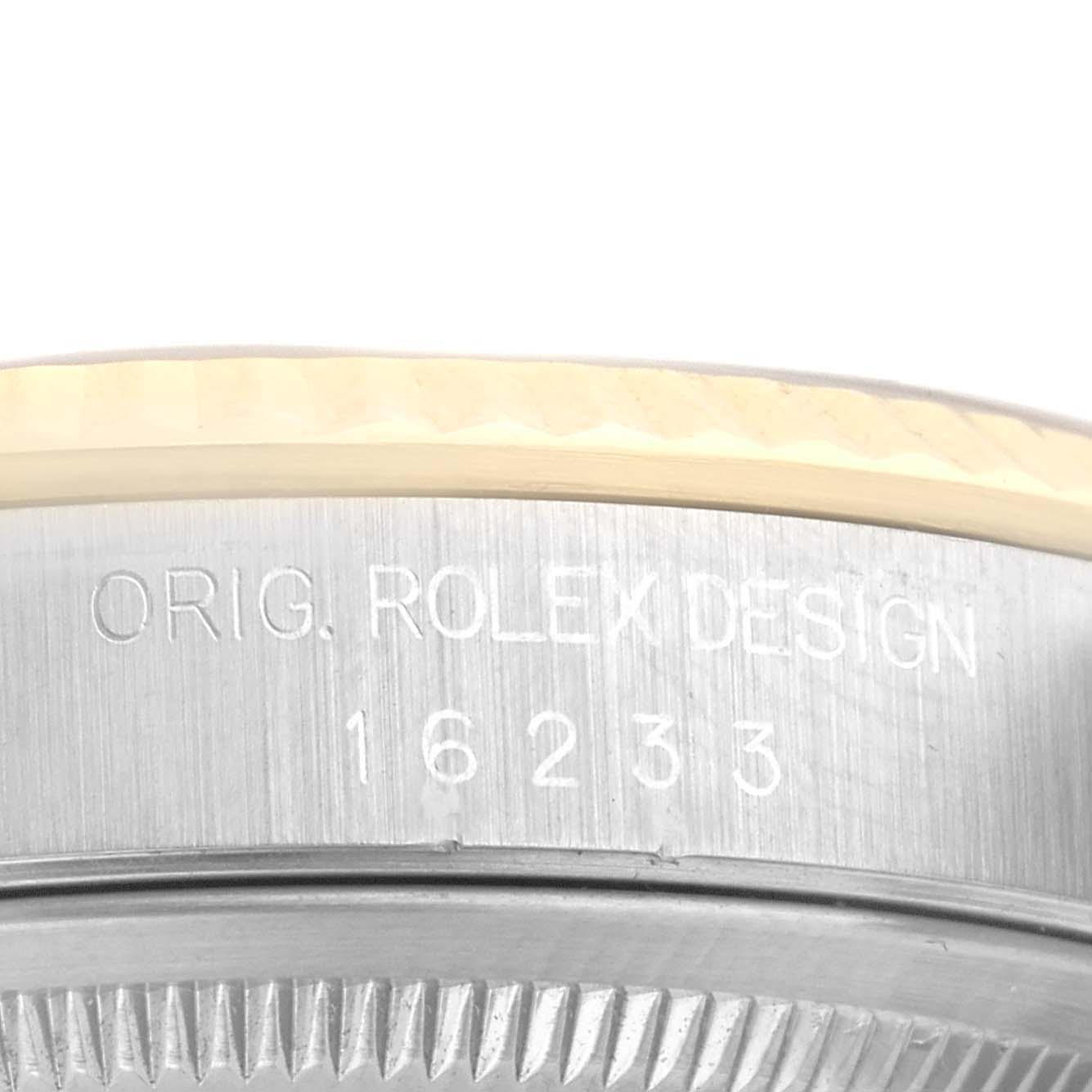 This image shows a close-up of the side of the bezel and case of a Rolex Datejust 16233 Men's Steel and Gold (two tone) White Dial 16233 Men's Steel and Gold (two tone) White Dial watch, revealing the engraved model number 16233.