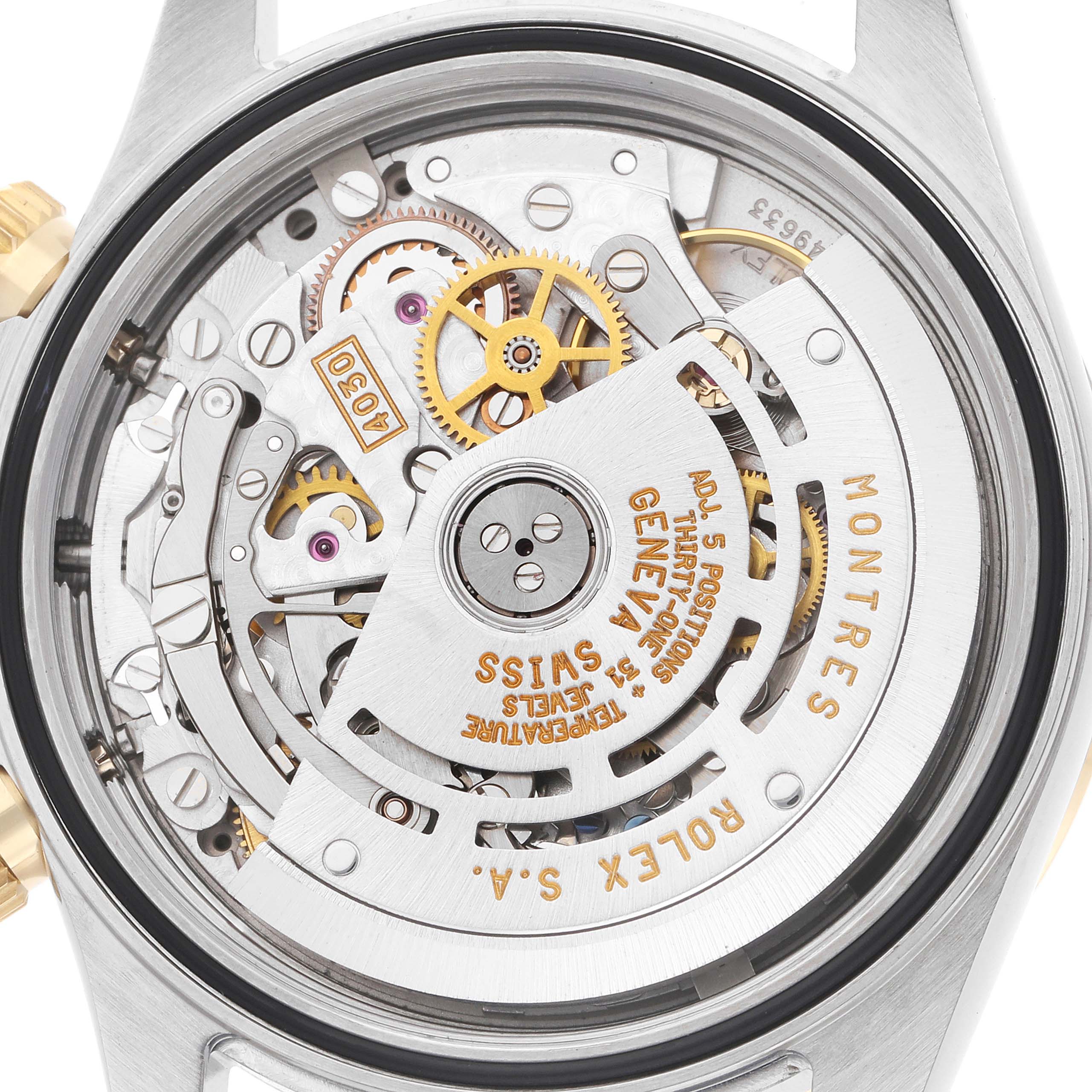 The image shows the back view of a Rolex Daytona 16523 Men
s Steel and Gold (two tone) Black Dial watch, displaying its intricate mechanical movement.