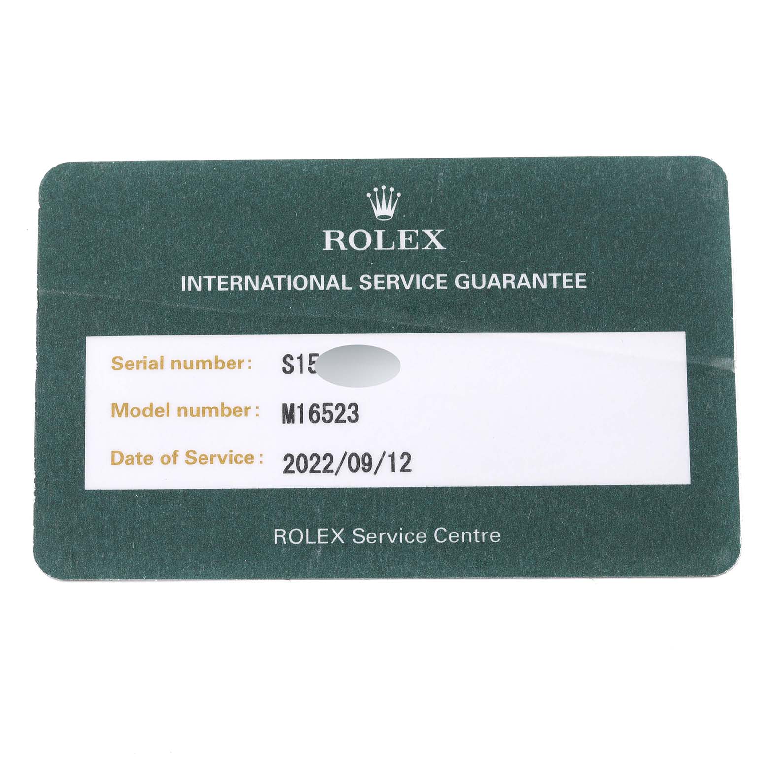 The image shows a Rolex International Service Guarantee card for a Rolex Daytona 16523 Men's Steel and Gold (two tone) White Dial 16523 Men's Steel and Gold (two tone) White Dial, model number M16523.