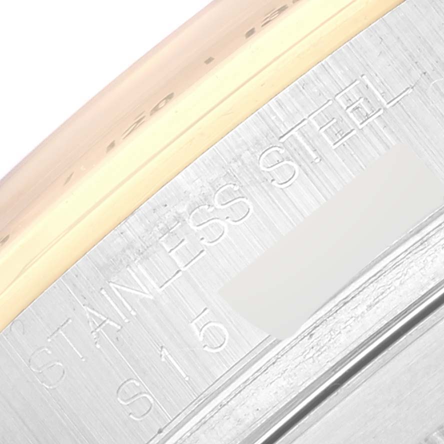 The image shows a close-up angle of the stainless steel bezel of a Rolex Daytona 16523 Men's Steel and Gold (two tone) White Dial 16523 Men's Steel and Gold (two tone) White Dial watch.