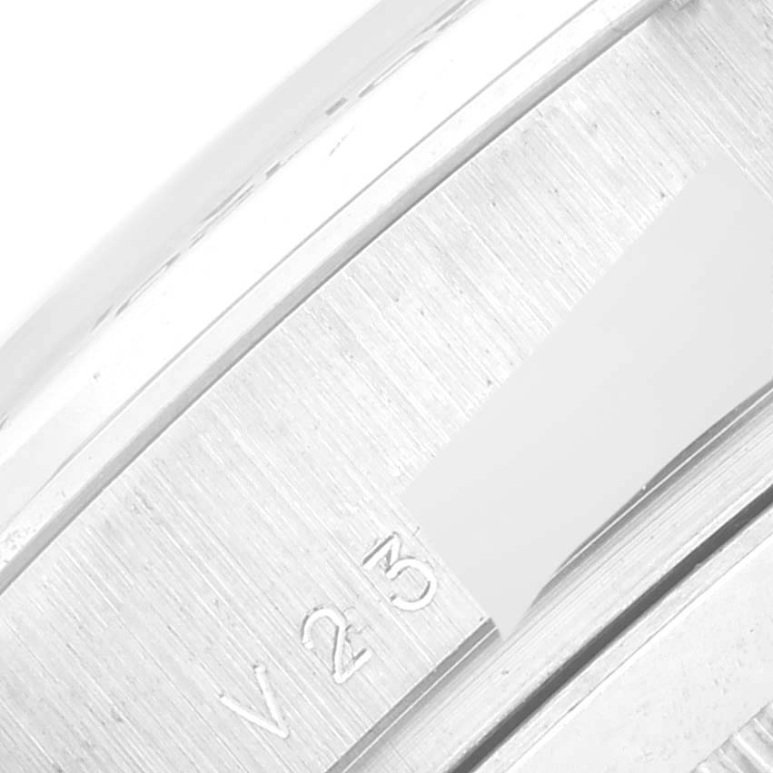 This close-up image shows the side case of a Rolex Daytona 116509 Men's White Gold Silver Dial 116509 Men's White Gold Silver Dial watch, highlighting the serial number engraving.