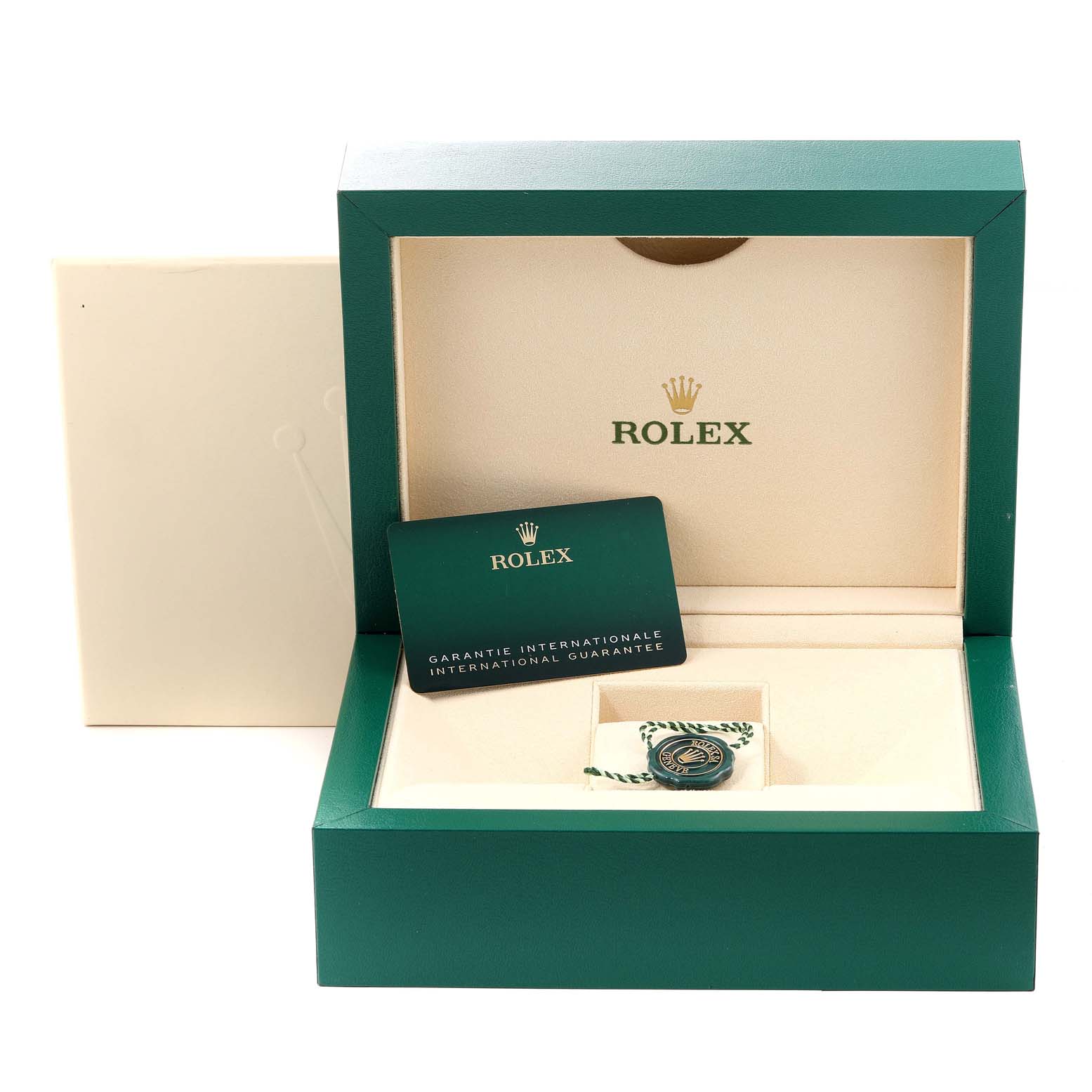 The image shows an open Rolex Daytona 116508 Men's Yellow Gold Green Dial 116508 Men's Yellow Gold Green Dial watch box with an international guarantee card and a tag inside.