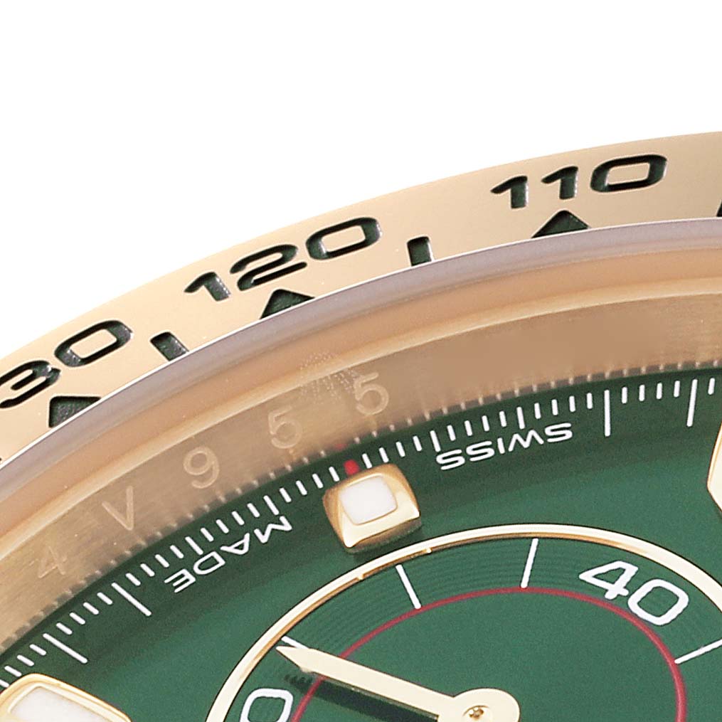 The image shows a close-up angle of the dial and bezel of a Rolex Daytona 116508 Men's Yellow Gold Green Dial 116508 Men's Yellow Gold Green Dial watch, highlighting the numerical markers and part of the green face.