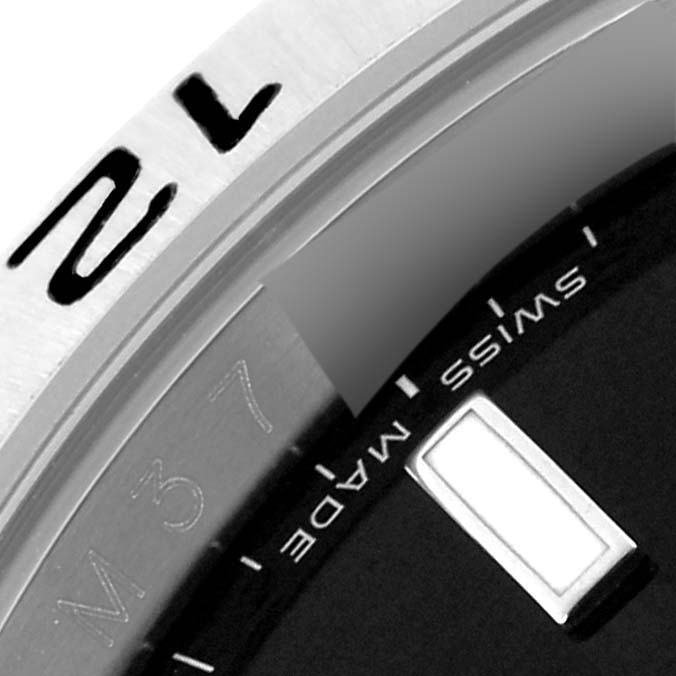 The image shows a close-up of the bezel and partial dial of a Rolex Explorer 16570T Men's Stainless Steel Black Dial 16570T Men's Stainless Steel Black Dial watch.