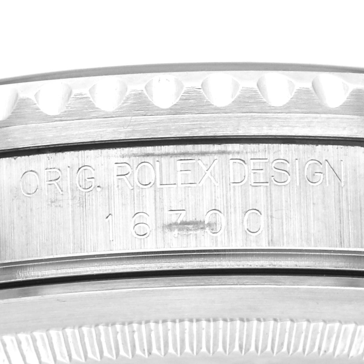 This image shows an engraved side view of the watch case on a Rolex GMT-Master 16700 Men's Stainless Steel Black Dial 16700 Men's Stainless Steel Black Dial with model number 16700.