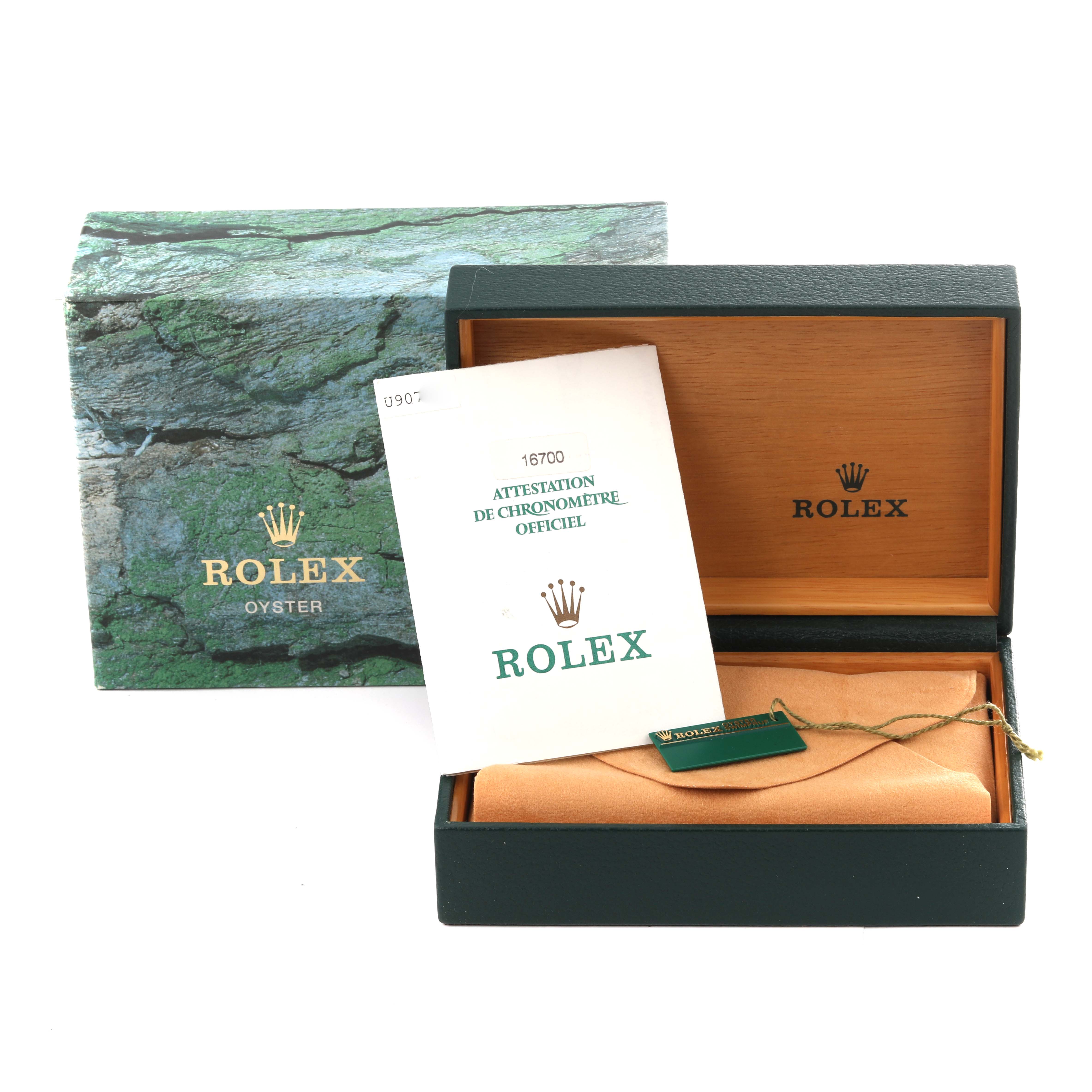 The image shows the packaging, a certificate, and a tag of the GMT-Master model by Rolex.