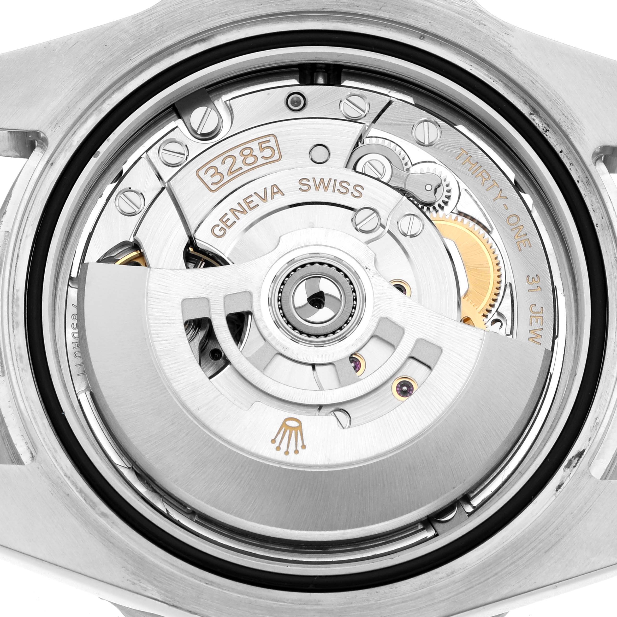 The image shows the movement mechanism of a Rolex GMT-Master 126710 Men
s Stainless Steel Black Dial watch, focusing on the rotor and inner components.