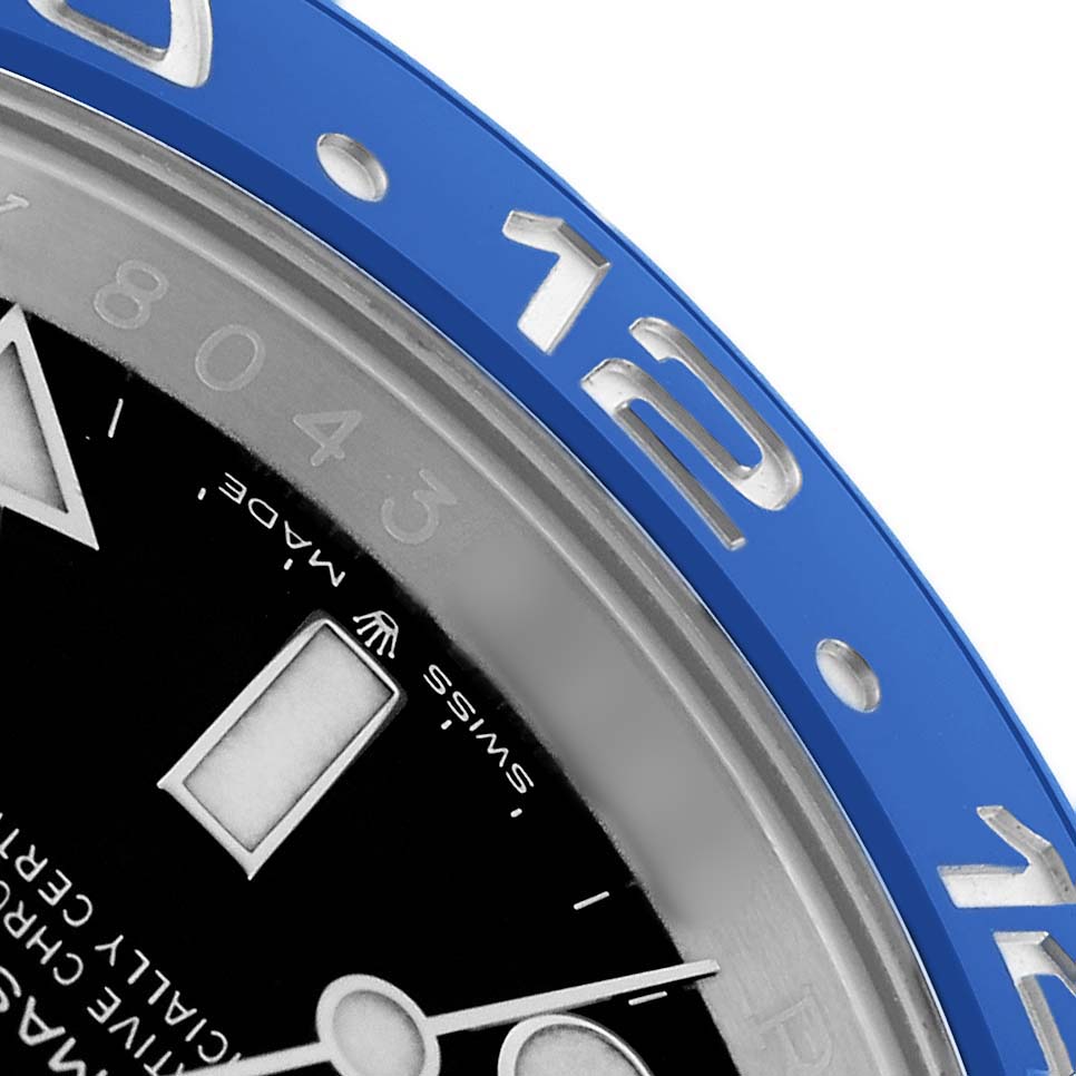 The image shows a partial close-up of the Rolex GMT-Master 126710 Men
s Stainless Steel Black Dial
s blue bezel, dial, and hands.