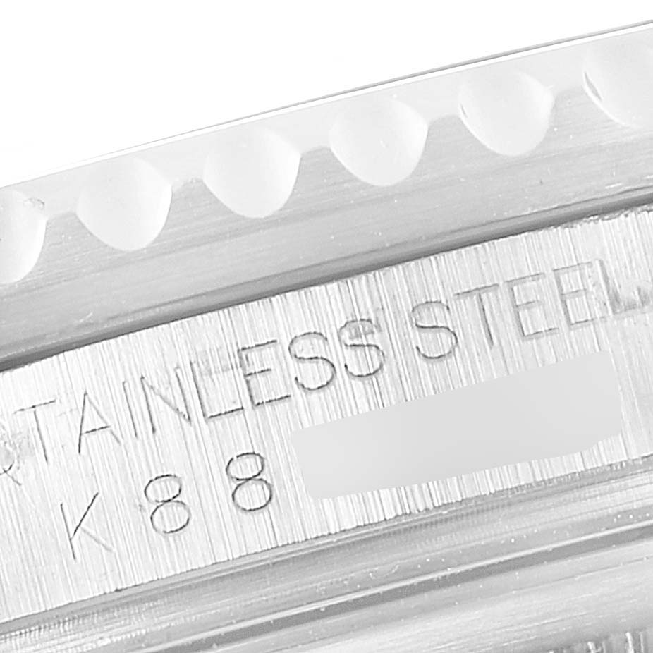 This close-up image shows the side of a Rolex GMT-Master 16710 Men
s Stainless Steel Black Dial 16710 Men
s Stainless Steel Black Dial watch case, highlighting the "STAINLESS STEEL" engraving.