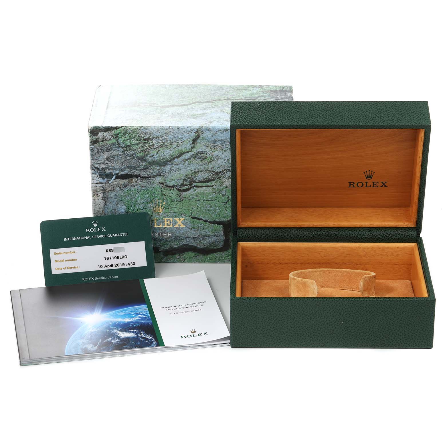 The image shows an empty open Rolex GMT-Master 16710 Men
s Stainless Steel Black Dial 16710 Men
s Stainless Steel Black Dial watch box with its packaging, warranty card, and booklet.