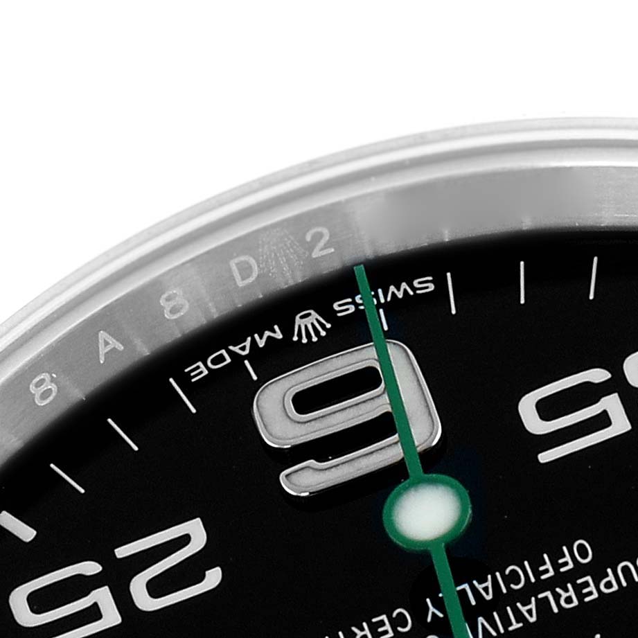 The image shows a close-up of the Rolex Air-King 126900 Men
s Stainless Steel Black Dial watch face, highlighting the "9" marker, green second hand, and "Swiss Made" text.