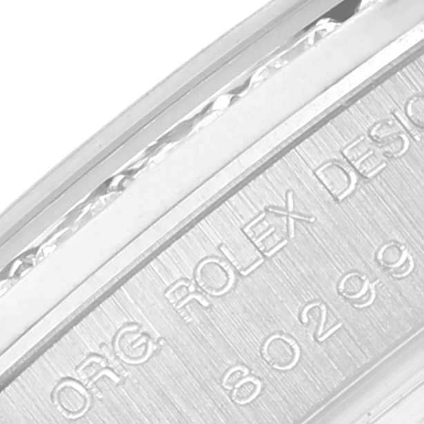 The image shows a close-up of the side engraving on a Rolex Pearlmaster 80299 Women's White Gold Silver Dial 80299 Women's White Gold Silver Dial watch case.