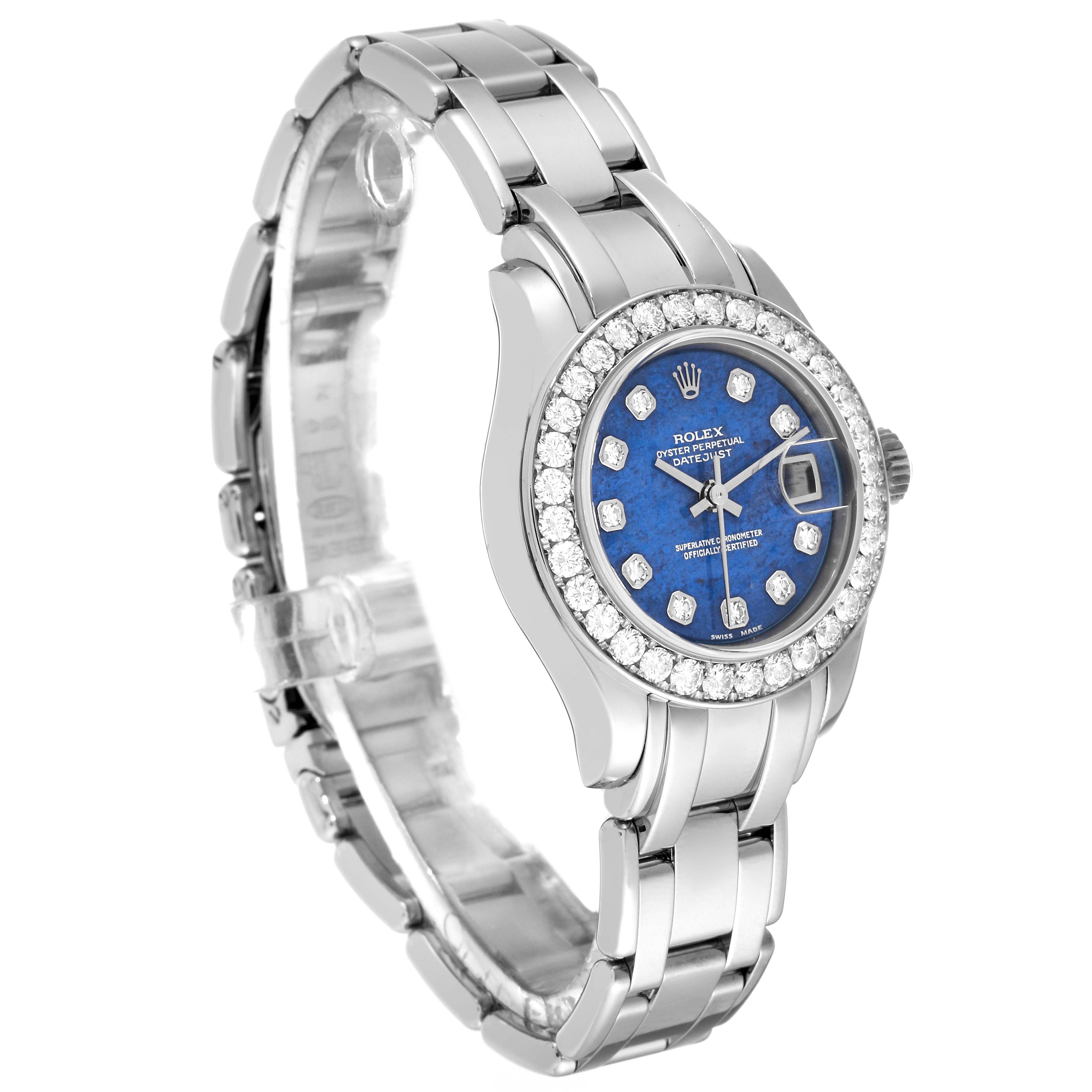 The image shows a side angle of the Rolex Pearlmaster 80299 Women's White Gold Blue Dial 80299 Women's White Gold Blue Dial watch, highlighting its blue dial, diamond bezel, and metal bracelet.