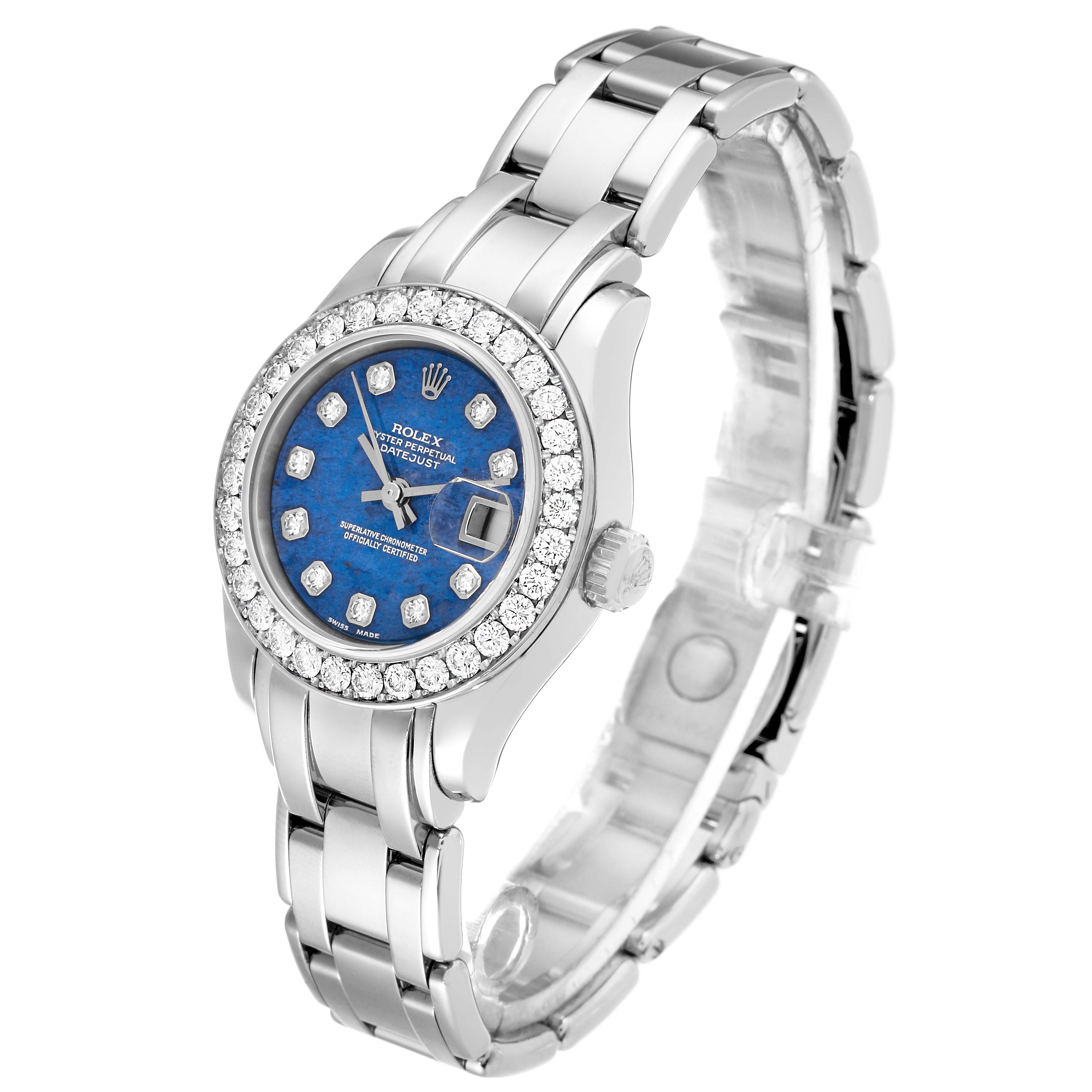 The image shows a Rolex Pearlmaster 80299 Women's White Gold Blue Dial 80299 Women's White Gold Blue Dial watch with a blue dial, diamond bezel, and silver bracelet, viewed at a slightly tilted angle.