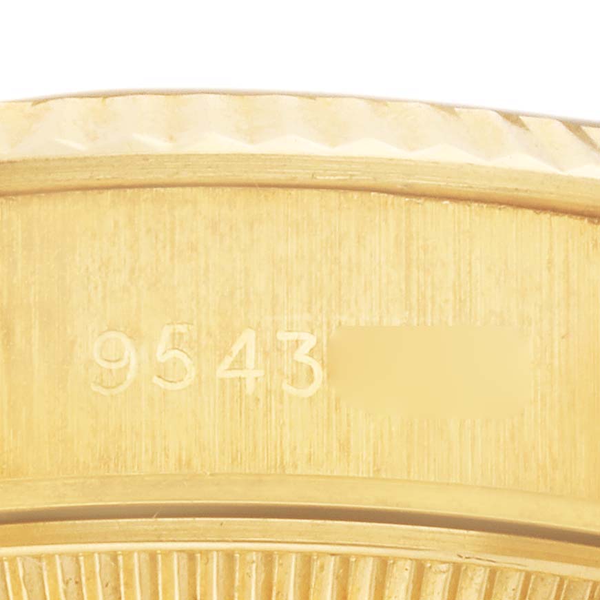 This is a close-up of the case and serial number of a Rolex President 69178 Women's Yellow Gold Champagne Dial 69178 Women's Yellow Gold Champagne Dial model watch.