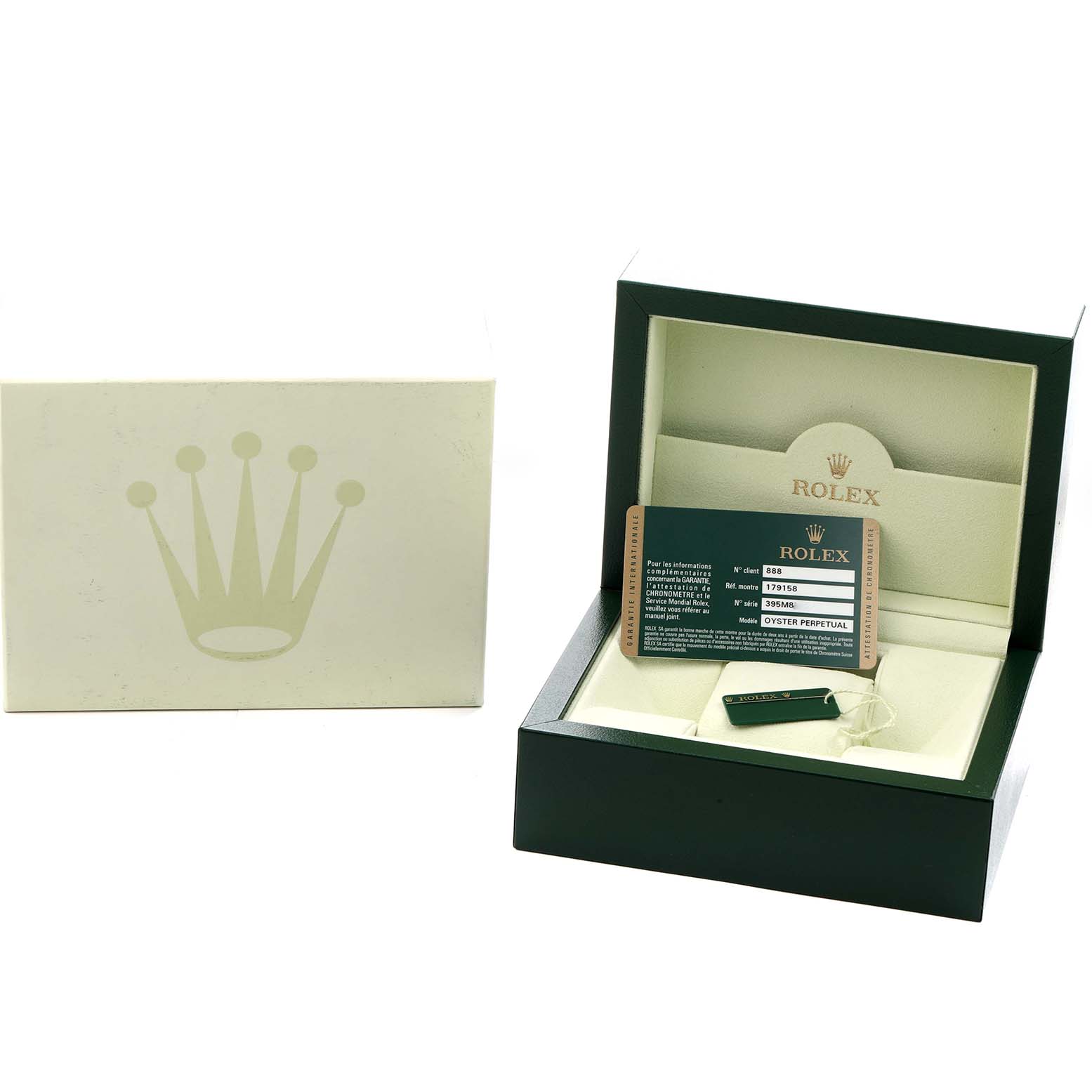 The image shows the open box and accessories for a Rolex Datejust 179158 Women
s Yellow Gold Champagne Dial, including a card and tag, viewed from the front.