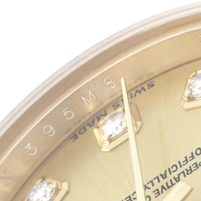The image shows a close-up of the Rolex Datejust 179158 Women
s Yellow Gold Champagne Dial watch, capturing the dial edge, diamond markers, and part of the hands.