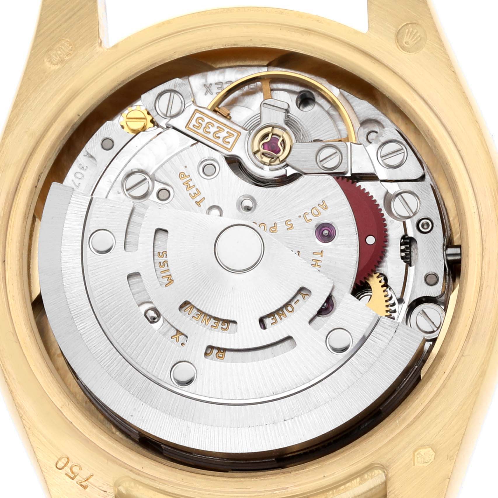 The image shows the movement of a Rolex Datejust 179158 Women
s Yellow Gold Champagne Dial watch, viewed from the back, highlighting its intricate mechanical components.