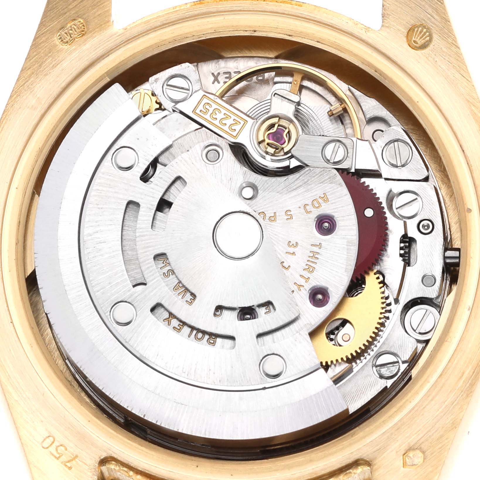 The image shows the movement of a Rolex President 179158 Women
s Yellow Gold Silver Dial model watch, highlighting gears and the rotor from the back view.